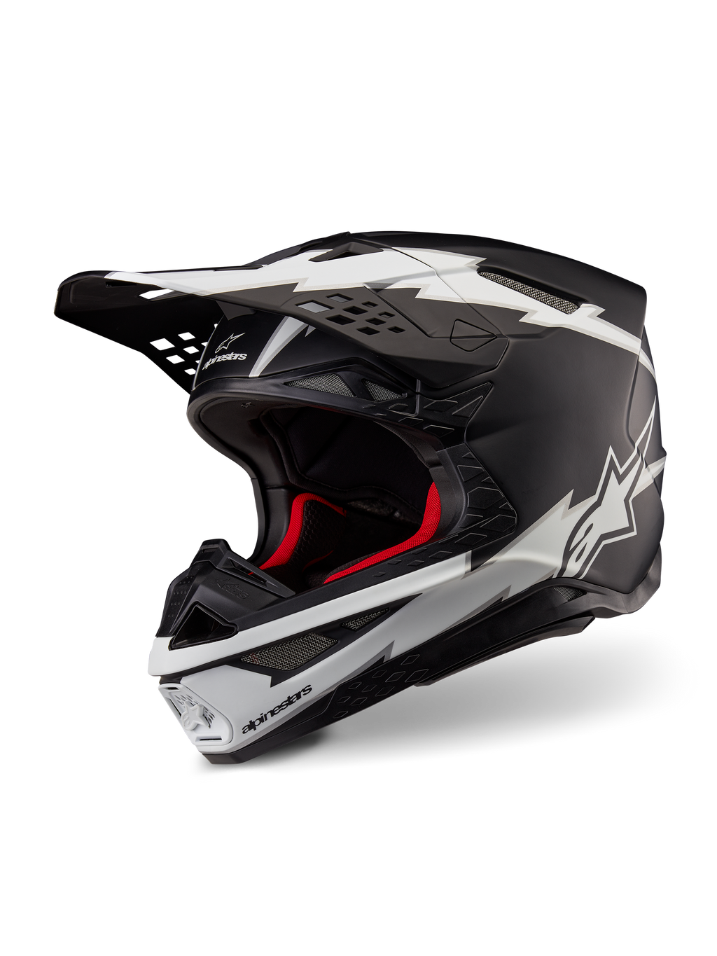Alpinestars Supertech M10 Ampress Helmet, kask motocrossowy, czarno-biały matowy, z wyrazistymi białymi grafikami w stylu błyskawic i logo gwiazdy, czerwona wyściółka wewnętrzna, wielokompozytowa skorupa z włókna węglowego o aerodynamicznym profilu