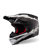 Alpinestars Supertech M10 Ampress Helmet, kask motocrossowy, czarno-biały matowy, z wyrazistymi białymi grafikami w stylu błyskawic i logo gwiazdy, czerwona wyściółka wewnętrzna, wielokompozytowa skorupa z włókna węglowego o aerodynamicznym profilu