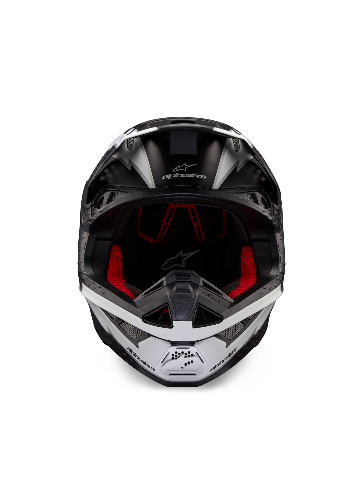 Kask Alpinestars Supertech M10 Ampress, kask motocrossowy, czarno-biały matowy, widok z przodu z czerwoną wyściółką wewnętrzną, aerodynamiczna skorupa z otworami wentylacyjnymi i logo Alpinestars