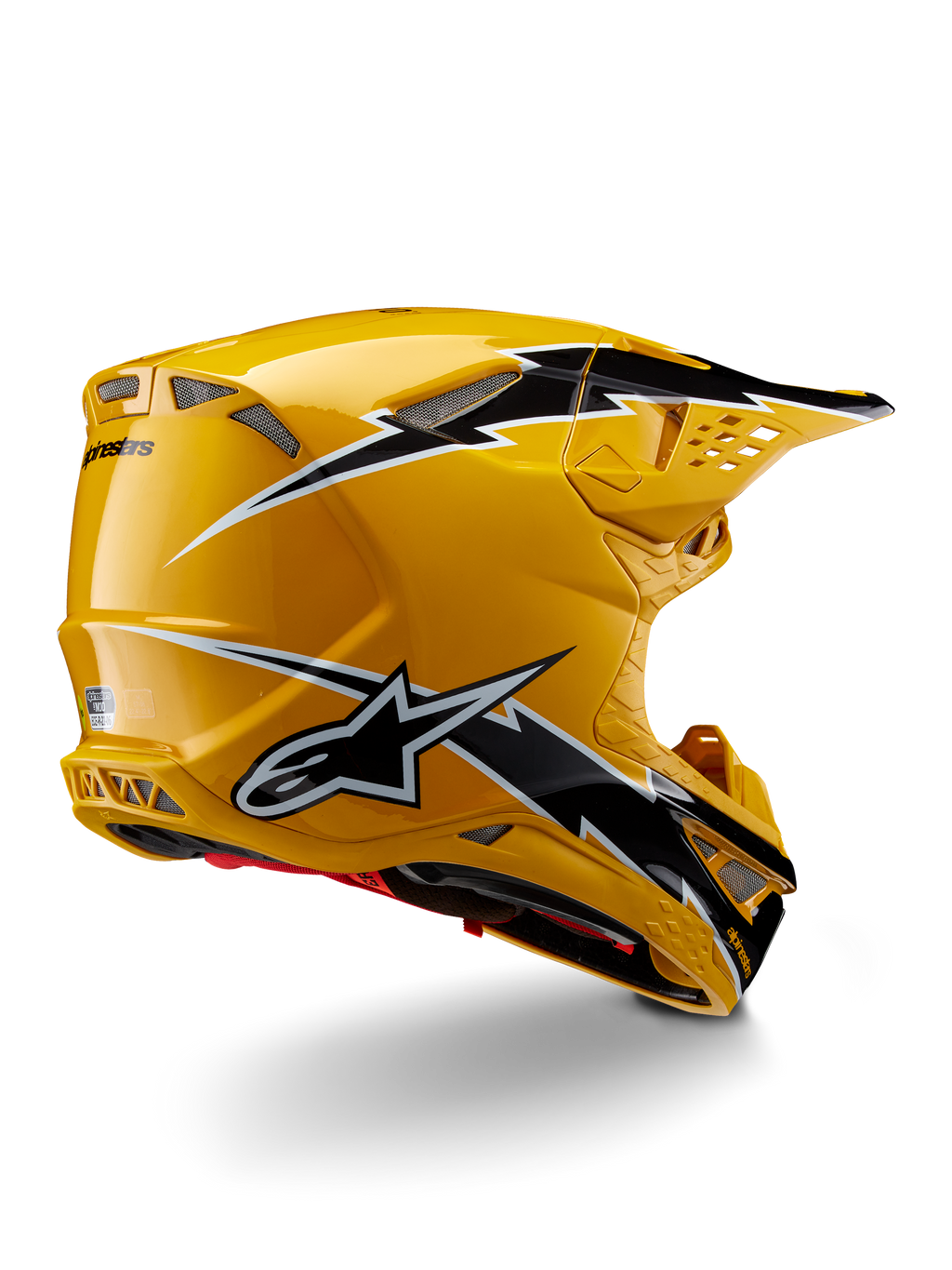 Alpinestars Supertech M10 Ampress Helmet, kask motocrossowy, czarno-żółty z połyskiem, żółte wykończenie o wysokim połysku z czarno-białą grafiką w stylu błyskawic, widok z tyłu pod kątem trzech czwartych ukazujący aerodynamiczną skorupę i zintegrowane otwory wentylacyjne