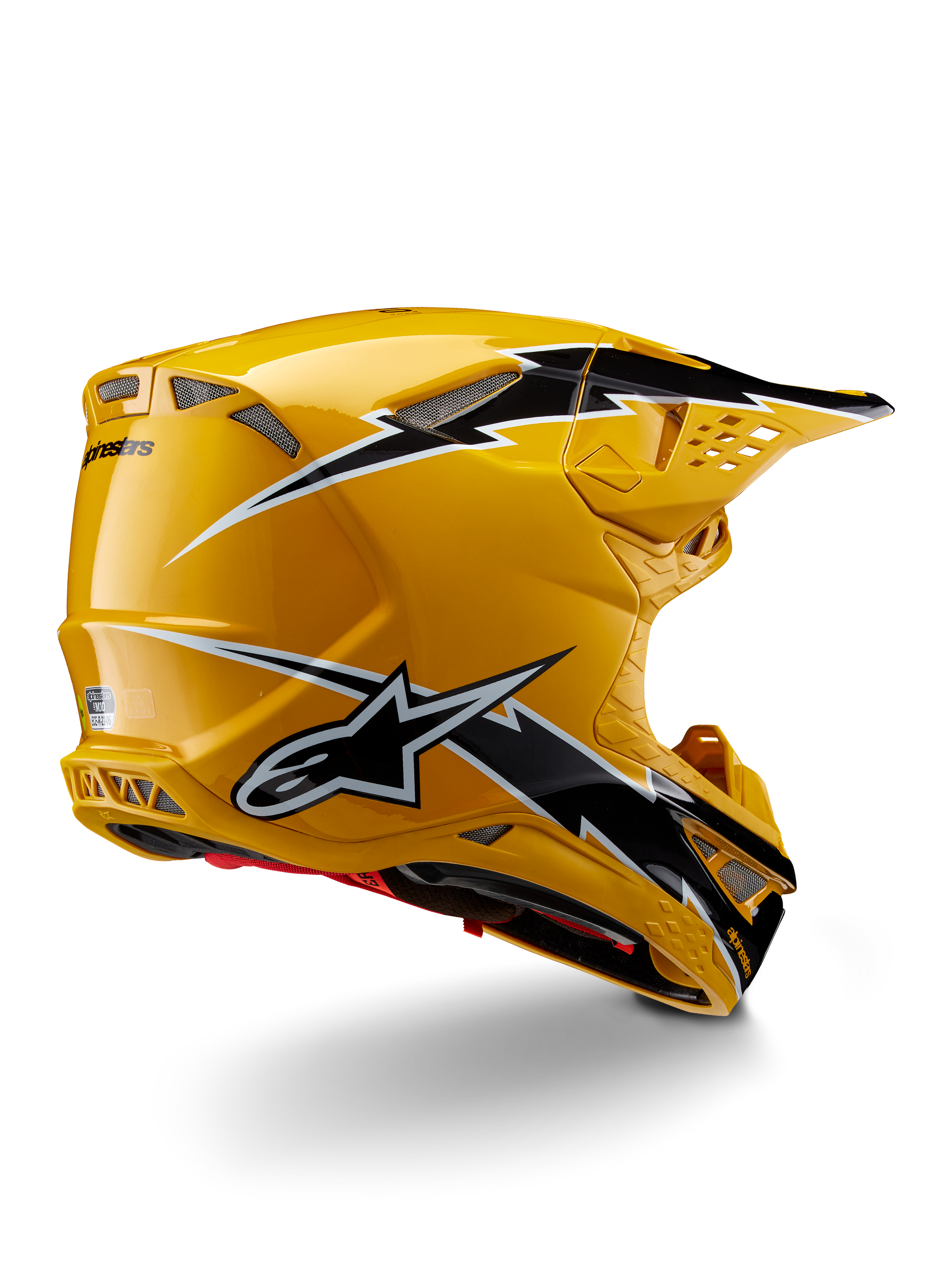 Alpinestars Supertech M10 Ampress Helmet, kask motocrossowy, czarno-żółty z połyskiem, żółte wykończenie o wysokim połysku z czarno-białą grafiką w stylu błyskawic, widok z tyłu pod kątem trzech czwartych ukazujący aerodynamiczną skorupę i zintegrowane otwory wentylacyjne