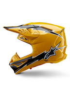 Kask Alpinestars Supertech M10 Ampress, kask motocrossowy, błyszczący żółty z czarno-białą grafiką, widok z boku z kanciastymi wzorami, logo gwiazdy Alpinestars, liczne otwory wentylacyjne ze srebrną siatką, profesjonalny sprzęt do wyścigów terenowych