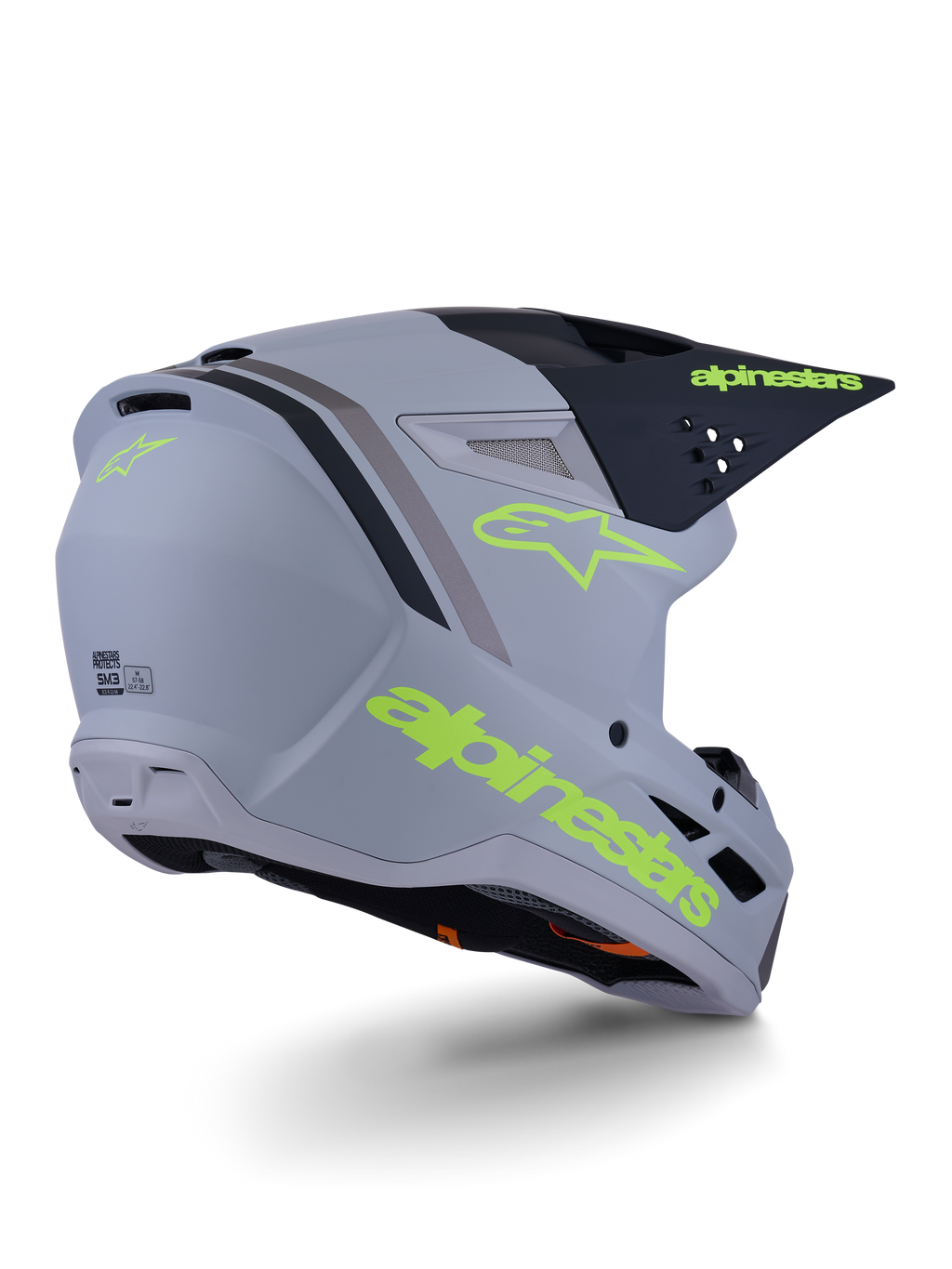 Kask Alpinestars S-M3 Radium, kask motocrossowy, szaro-czarny i żółty neonowy mat, konstrukcja typu full-face z kanciastą skorupą, wydatny daszek i otwory wentylacyjne, matowe wykończenie z wyrazistą grafiką