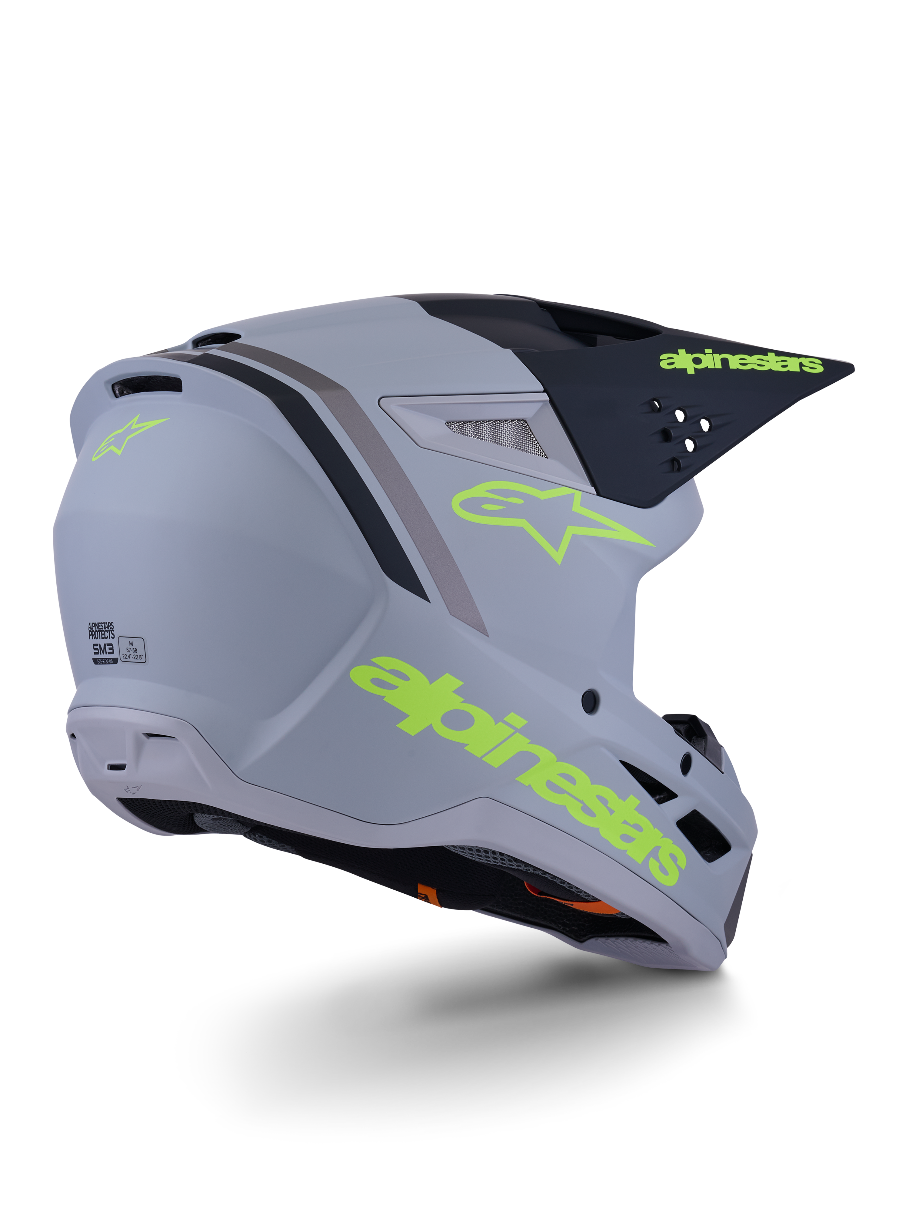 Kask Alpinestars S-M3 Radium, kask motocrossowy, szaro-czarny i żółty neonowy mat, konstrukcja typu full-face z kanciastą skorupą, wydatny daszek i otwory wentylacyjne, matowe wykończenie z wyrazistą grafiką