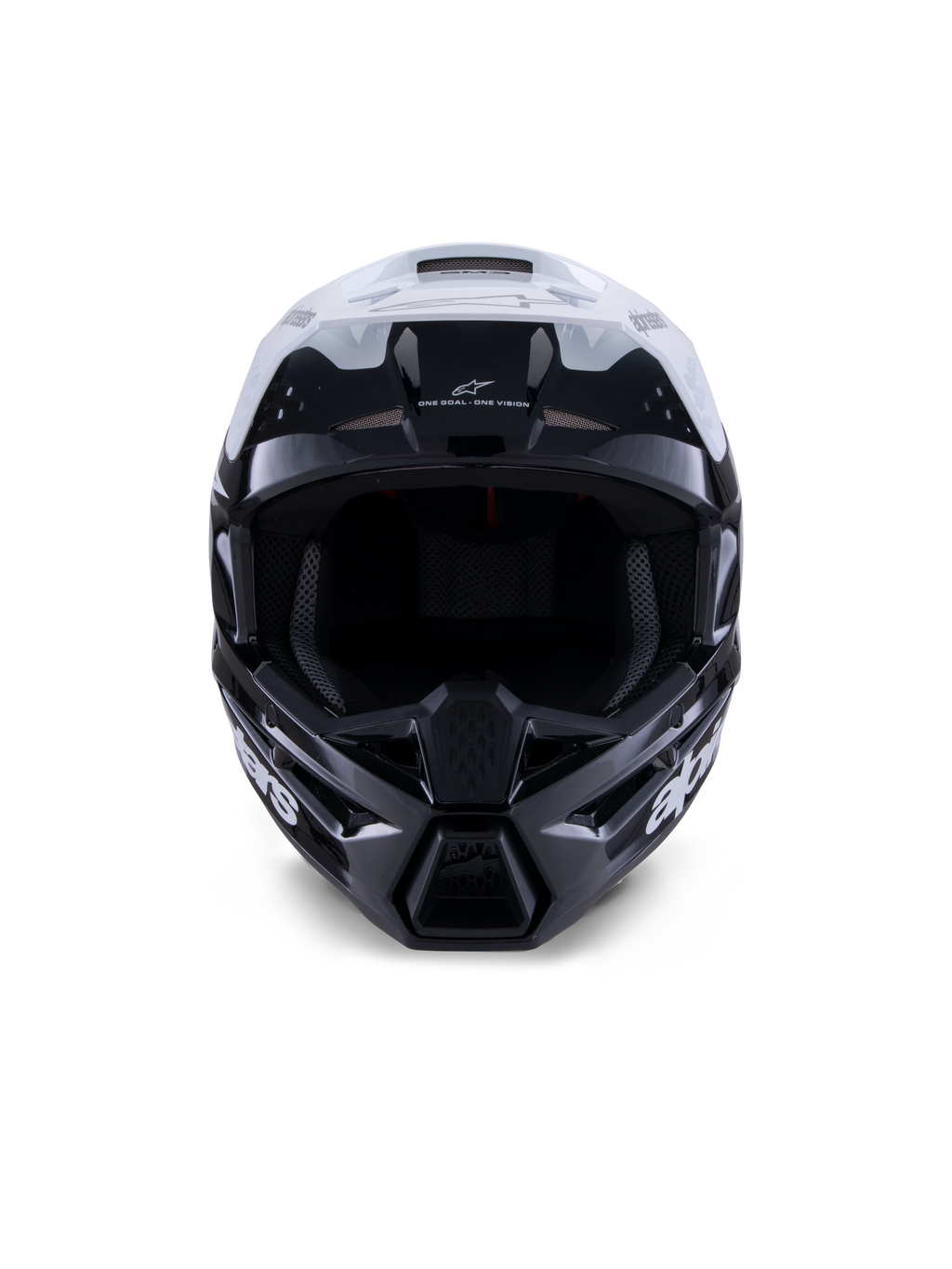 Kask Alpinestars S-M3 Radium, kask motocrossowy, czarno-biało-szary z połyskiem, widok z przodu, agresywny design skorupy z białym daszkiem, czarną osłoną szczęki i otworami wentylacyjnymi z siateczką.