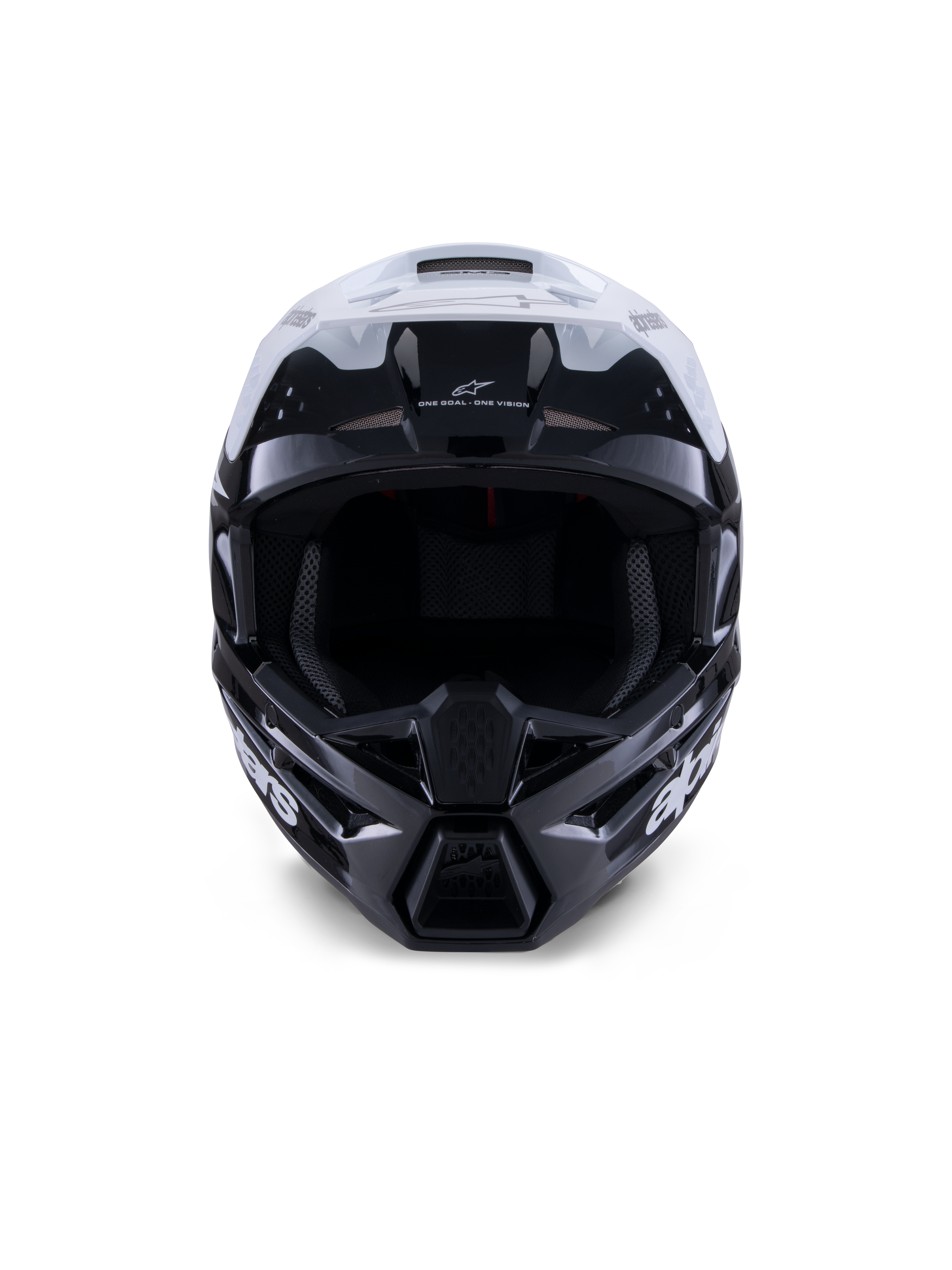 Kask Alpinestars S-M3 Radium, kask motocrossowy, czarno-biało-szary z połyskiem, widok z przodu, agresywny design skorupy z białym daszkiem, czarną osłoną szczęki i otworami wentylacyjnymi z siateczką.