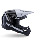 Kask Alpinestars S-M3 Radium, kask motocrossowy off-road, czarno-biało-szary z połyskiem, kanciasty aerodynamiczny design z otworami wentylacyjnymi, widok z profilu, błyszczące wykończenie z szarymi pasami, biały daszek z logo Alpinestars