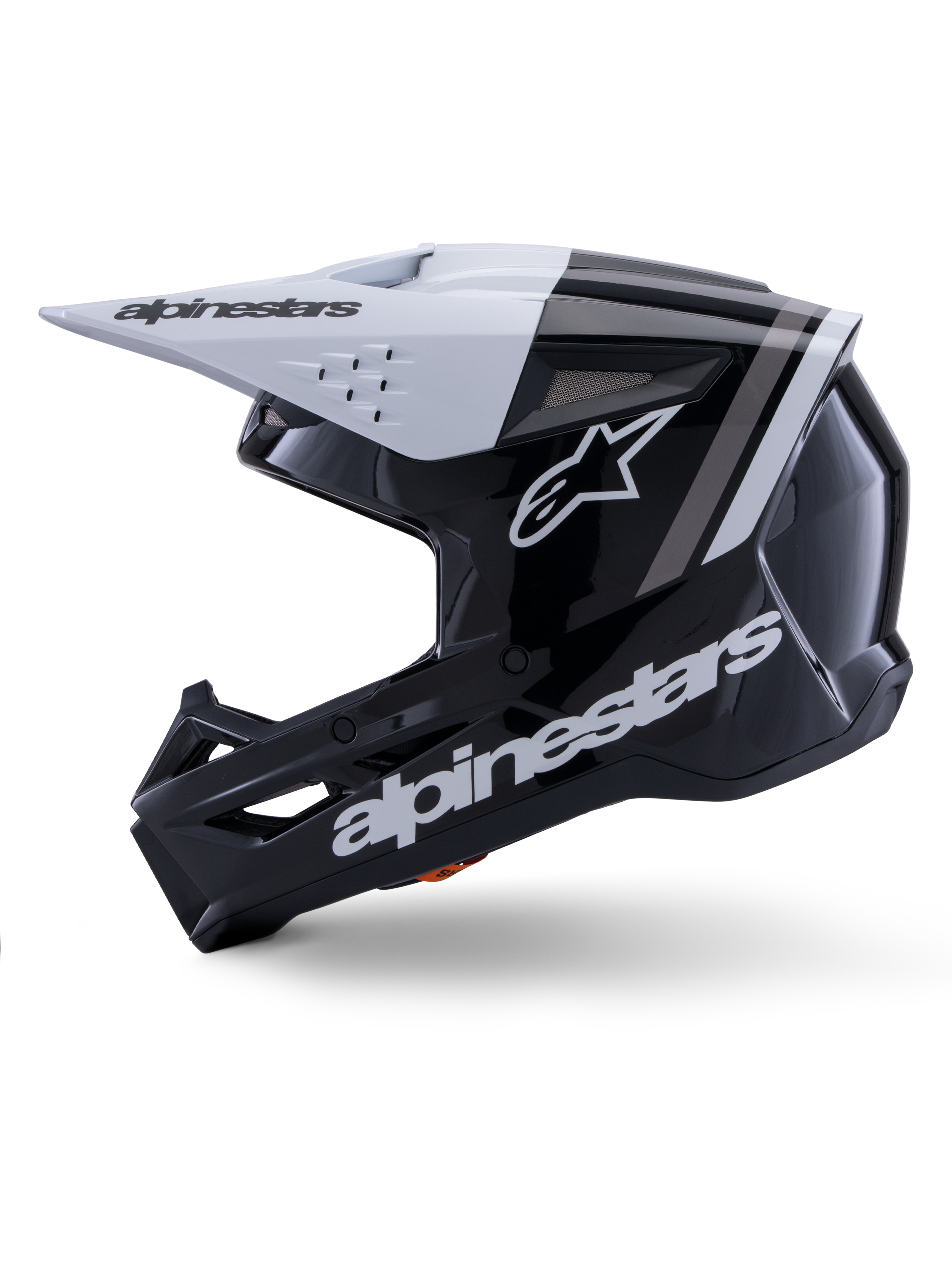 Alpinestars S-M3 Radium Helmet ECE 22.06, widok z profilu, błyszczące czarno-białe wykończenie, szare paski wyścigowe, białe logo Alpinestars z boku i na szczęce, wentylowana konstrukcja do motocrossu i enduro
