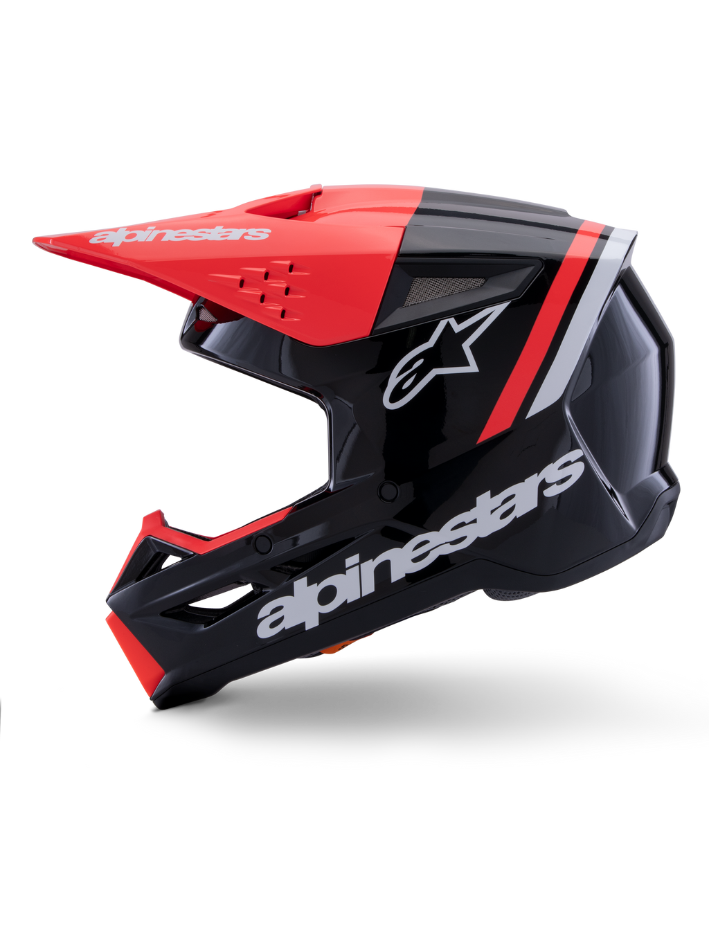 Kask Alpinestars S-M3 Radium, kask motocrossowy, czarny, czerwony fluo i biały z połyskiem, widok z profilu, duże białe logo Alpinestars i gwiazdy, daszek i akcenty na szczęce w kolorze czerwonym fluo, błyszczące wykończenie, zaprojektowany do jazdy MX i Enduro.
