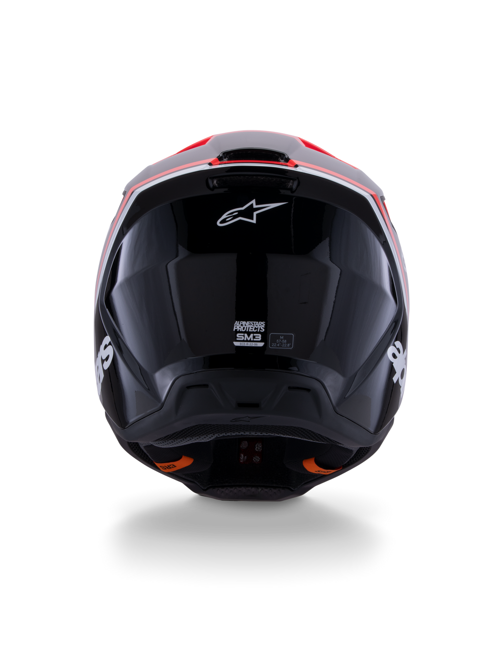 Kask Alpinestars S-M3 Radium ECE 22.06, kask motocrossowy, błyszczący czarny z czerwonymi fluo i białymi akcentami, widok z tyłu prezentujący aerodynamiczny design skorupy, białe logo gwiazdy i etykiety certyfikacyjne