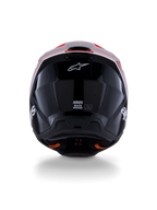 Kask Alpinestars S-M3 Radium ECE 22.06, kask motocrossowy, błyszczący czarny z czerwonymi fluo i białymi akcentami, widok z tyłu prezentujący aerodynamiczny design skorupy, białe logo gwiazdy i etykiety certyfikacyjne