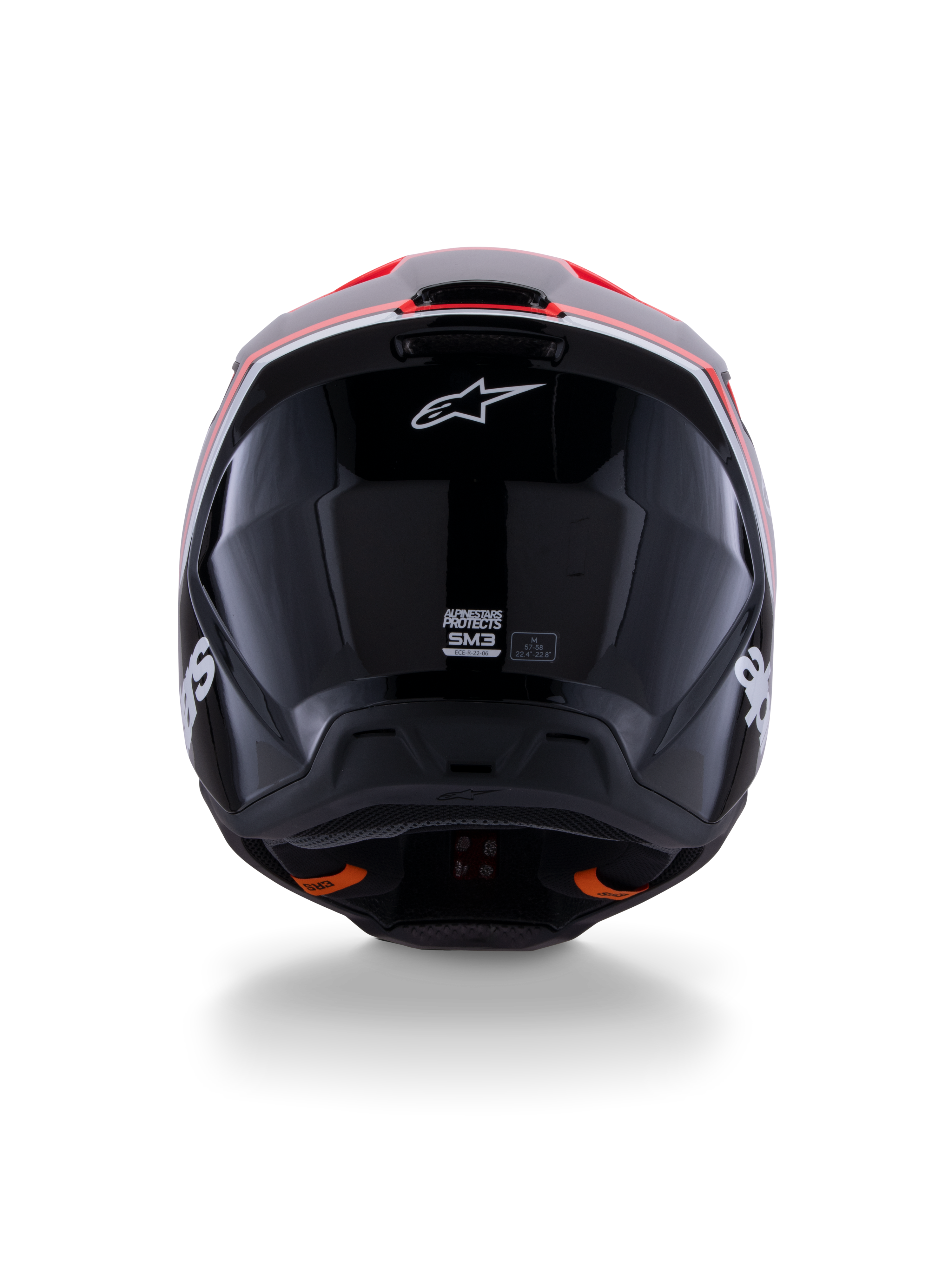 Kask Alpinestars S-M3 Radium ECE 22.06, kask motocrossowy, błyszczący czarny z czerwonymi fluo i białymi akcentami, widok z tyłu prezentujący aerodynamiczny design skorupy, białe logo gwiazdy i etykiety certyfikacyjne