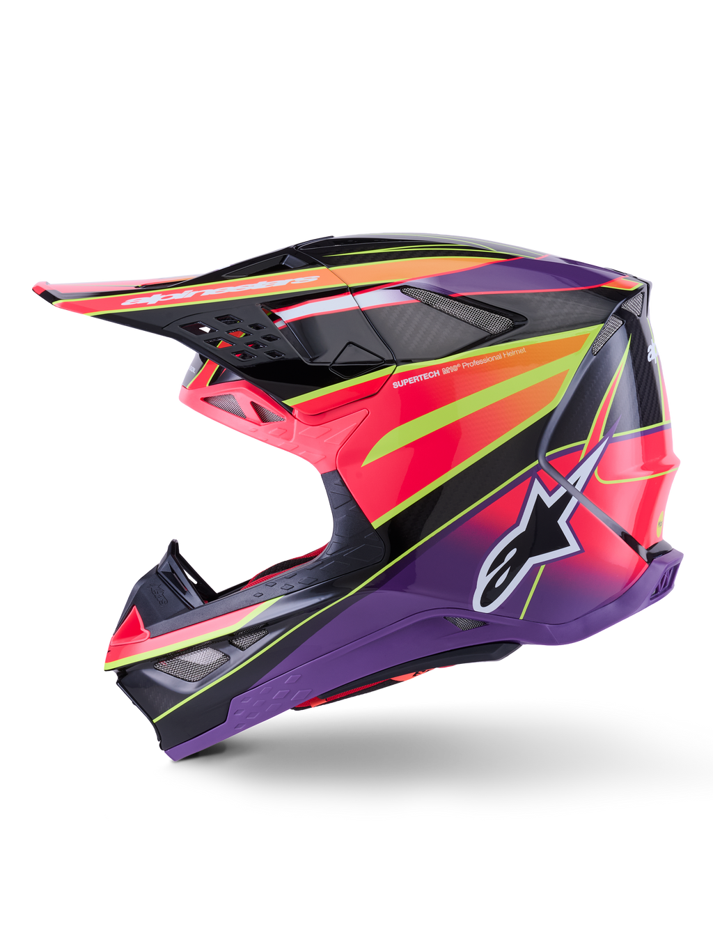 Kask Alpinestars Supertech M10 Era, kask motocrossowy, różowo-fioletowy i neonowy żółty z połyskiem, widok z profilu bocznego prezentujący wyraziste grafiki geometryczne i teksturę włókna węglowego, logo gwiazdy Alpinestars, zintegrowane otwory wentylacyjne, smukły aerodynamiczny design do wyścigów off-road.