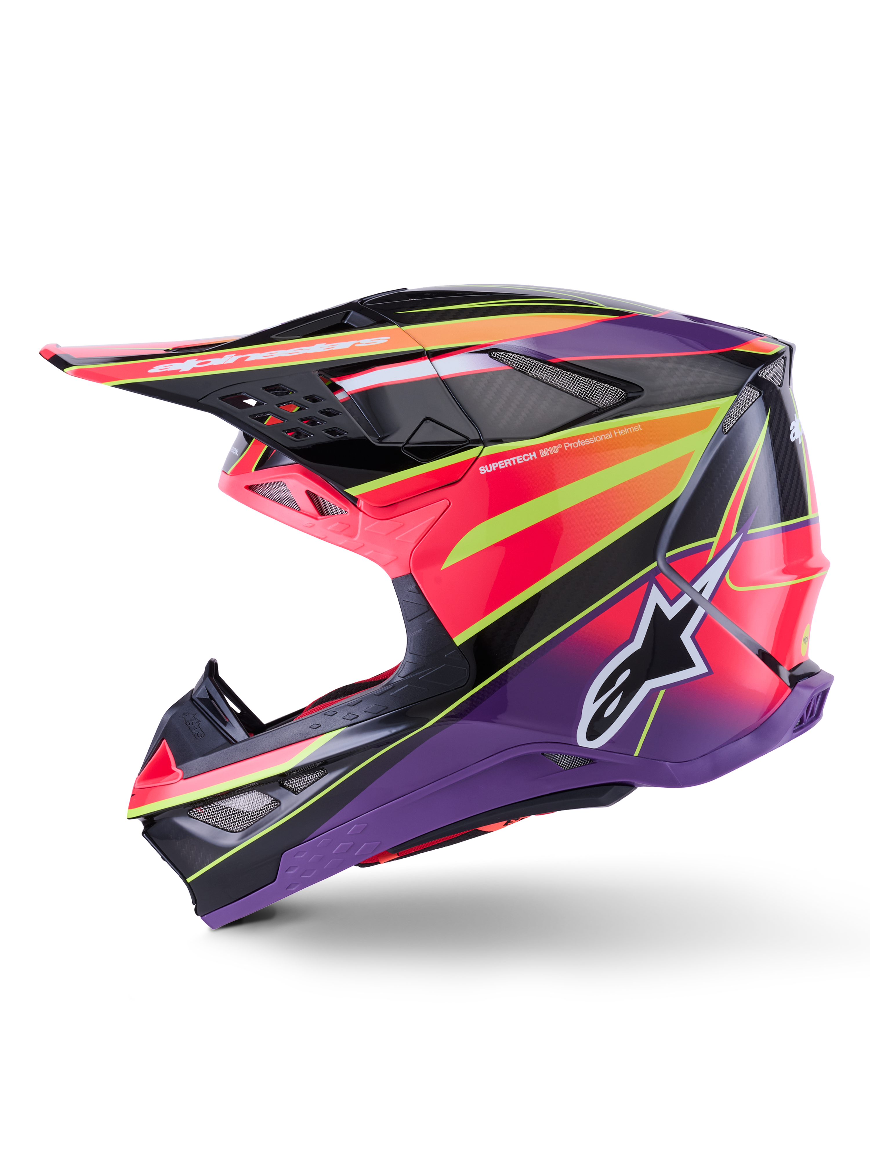 Kask Alpinestars Supertech M10 Era, kask motocrossowy, różowo-fioletowy i neonowy żółty z połyskiem, widok z profilu bocznego prezentujący wyraziste grafiki geometryczne i teksturę włókna węglowego, logo gwiazdy Alpinestars, zintegrowane otwory wentylacyjne, smukły aerodynamiczny design do wyścigów off-road.