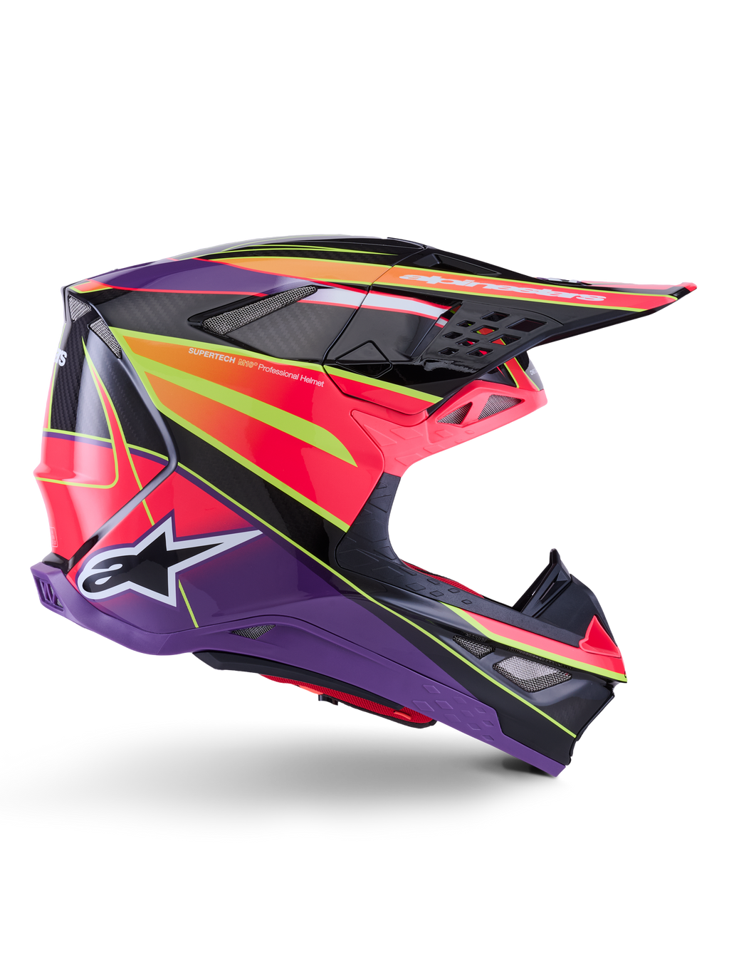 Kask Alpinestars Supertech M10 Era, kask motocrossowy, różowy, fioletowy i żółty fluo z połyskiem, widok z profilu, posiada wielokompozytową skorupę z włókna węglowego z wyrazistymi wzorami geometrycznymi, zintegrowane otwory wentylacyjne i białe logo Alpinestars, zaprojektowany z myślą o profesjonalnej jeździe terenowej