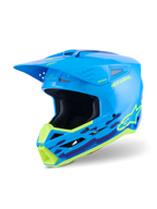 Kask Alpinestars S-M3 Force OCD, kask motocrossowy, błękitny połysk z neonowożółtymi i fioletowymi falistymi grafikami, wykończenie na wysoki połysk z wyraźnym logo Alpinestars, zaprojektowany z myślą o ochronie przed uderzeniami i wentylacji off-road