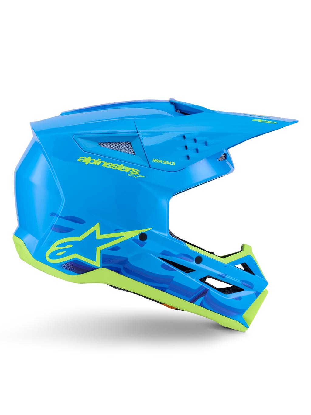 Kask Alpinestars S-M3 Force OCD, motocrossowy kask terenowy, błyszczący cyjan z neonowożółtymi detalami, certyfikat ECE 22.06, aerodynamiczna skorupa z otworami wentylacyjnymi, spiczasty daszek i grafiki z logo gwiazdy