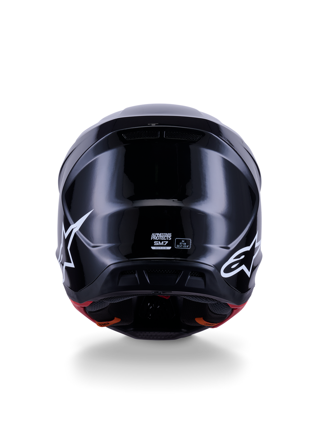 Alpinestars S-M7 Solid Helmet ECE 22.06, kask motocrossowy, czarny połysk, widok z tyłu z białymi logo gwiazdy, aerodynamiczna kompozytowa skorupa z wykończeniem na wysoki połysk, certyfikat bezpieczeństwa i oznaczenie rozmiaru na środku