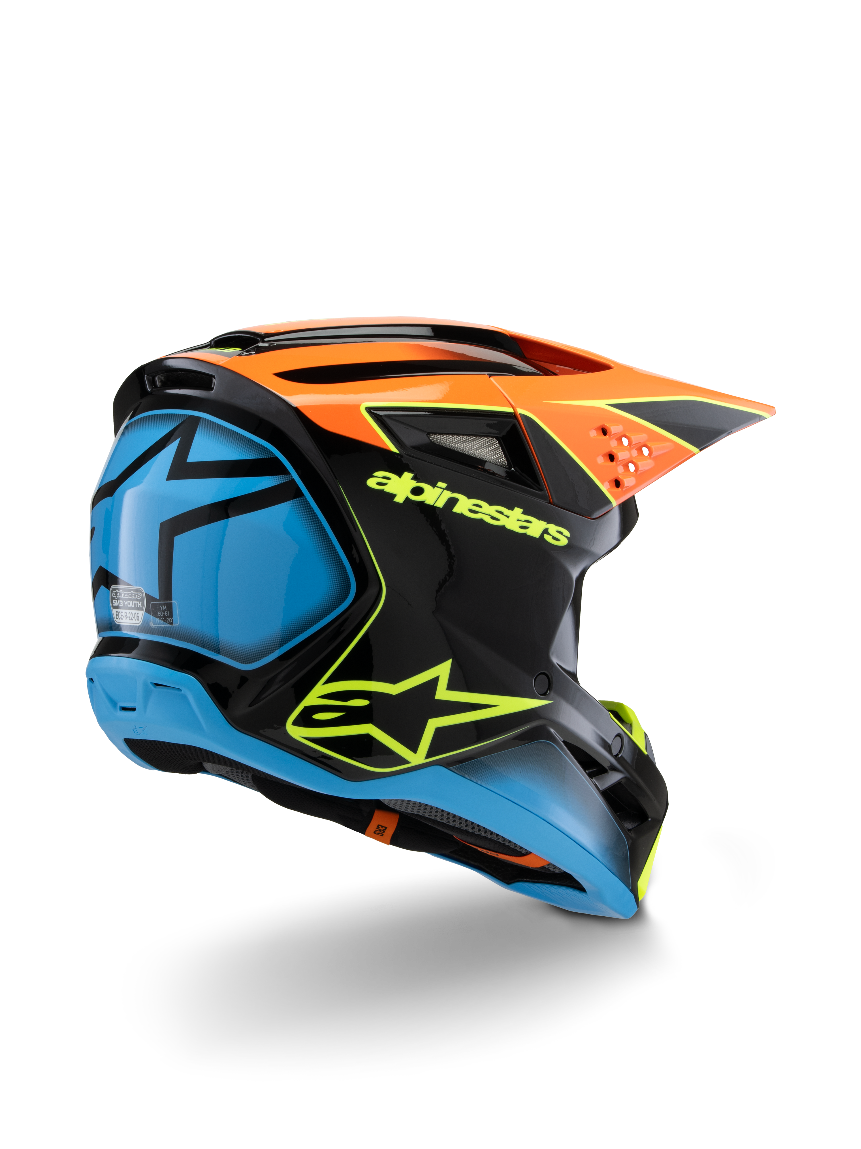 Alpinestars S-M3 Youth Fray Helmet, kask motocrossowy, czarny, pomarańczowy i niebieski z neonowożółtymi akcentami, widok z tyłu pod kątem trzech czwartych pokazujący wyraźne logo Alpinestars i symbol gwiazdy, smukły aerodynamiczny design do młodzieżowych wyścigów terenowych