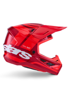 Kask Alpinestars S-M7 Core, kask motocrossowy, błyszczący czerwony z ciemnoczerwonymi akcentami i białym brandingiem, widok z boku z dużym białym logo stars, aerodynamiczna skorupa z siatkowymi otworami wentylacyjnymi i wyraźnym daszkiem