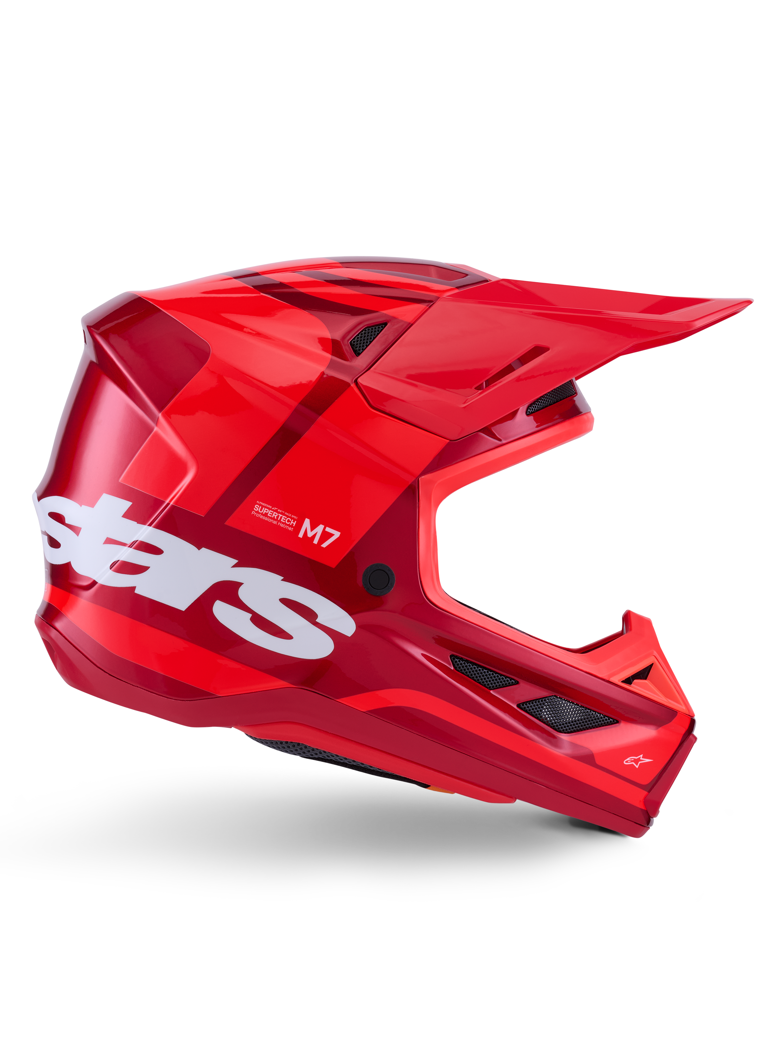 Kask Alpinestars S-M7 Core, kask motocrossowy, błyszczący czerwony z ciemnoczerwonymi akcentami i białym brandingiem, widok z boku z dużym białym logo stars, aerodynamiczna skorupa z siatkowymi otworami wentylacyjnymi i wyraźnym daszkiem