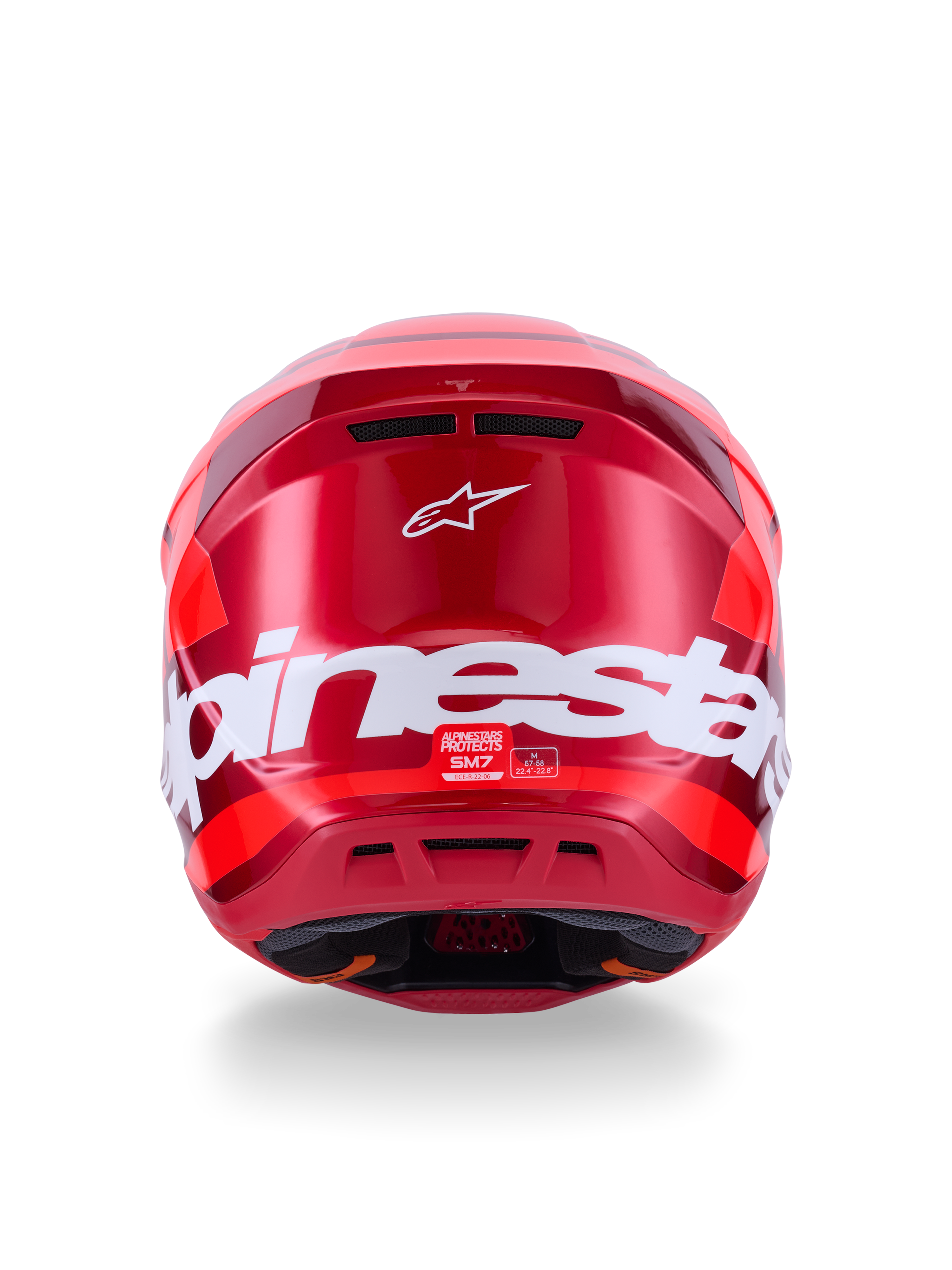 Kask Alpinestars S-M7 Core, czerwony błyszczący, widok z tyłu z dużym białym brandingiem Alpinestars, aerodynamiczna skorupa ze zintegrowanymi otworami wentylacyjnymi, profesjonalna ochrona głowy do motocrossu