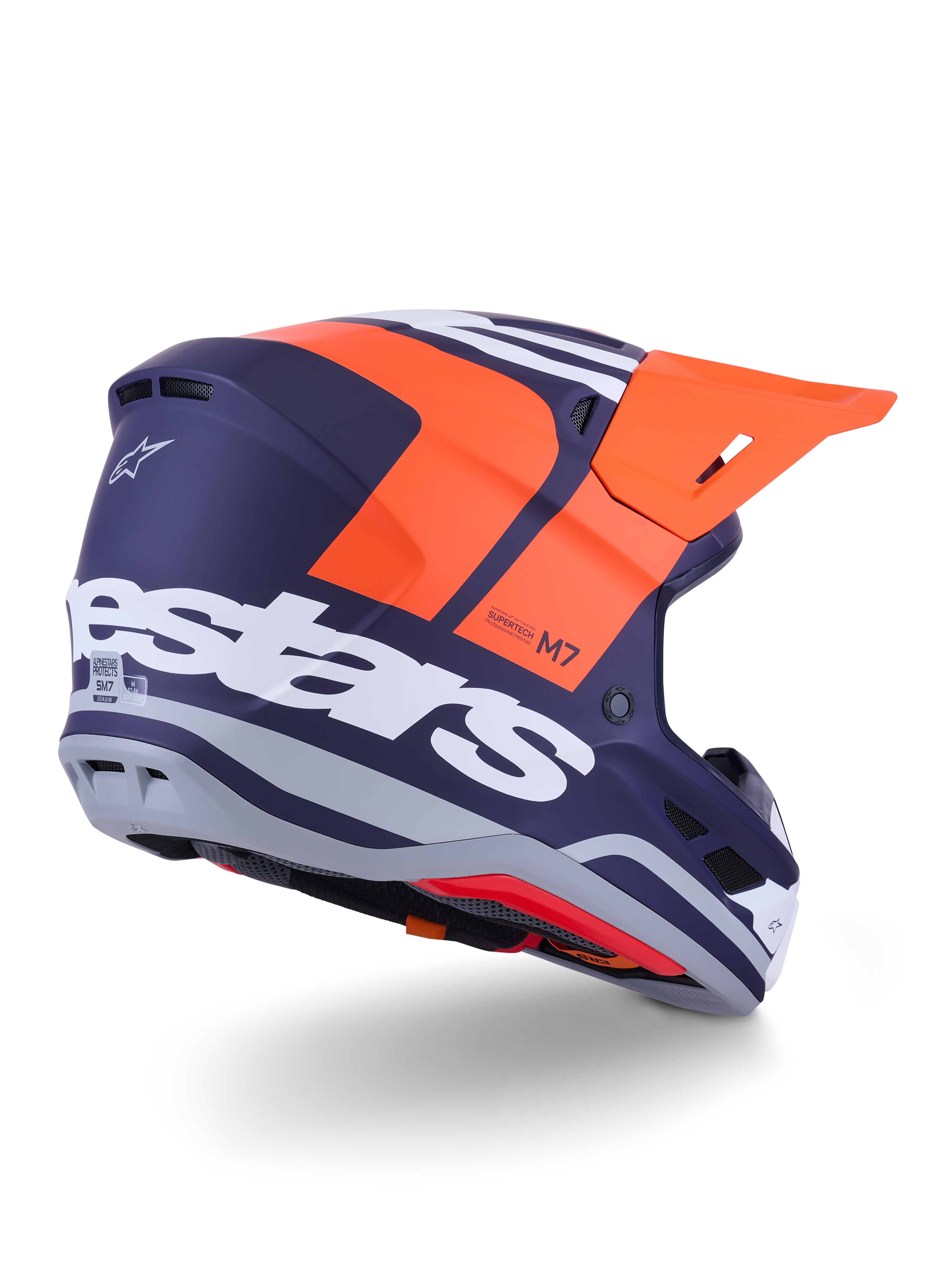 Kask Alpinestars S-M7 Core, kask motocrossowy, pomarańczowo-niebieski mat, widok z tyłu i z boku z wyraźnym białym logo Alpinestars z tyłu, jaskrawopomarańczowy daszek, aerodynamiczna skorupa kompozytowa z szarymi akcentami, profesjonalna ochrona do wyścigów off-road