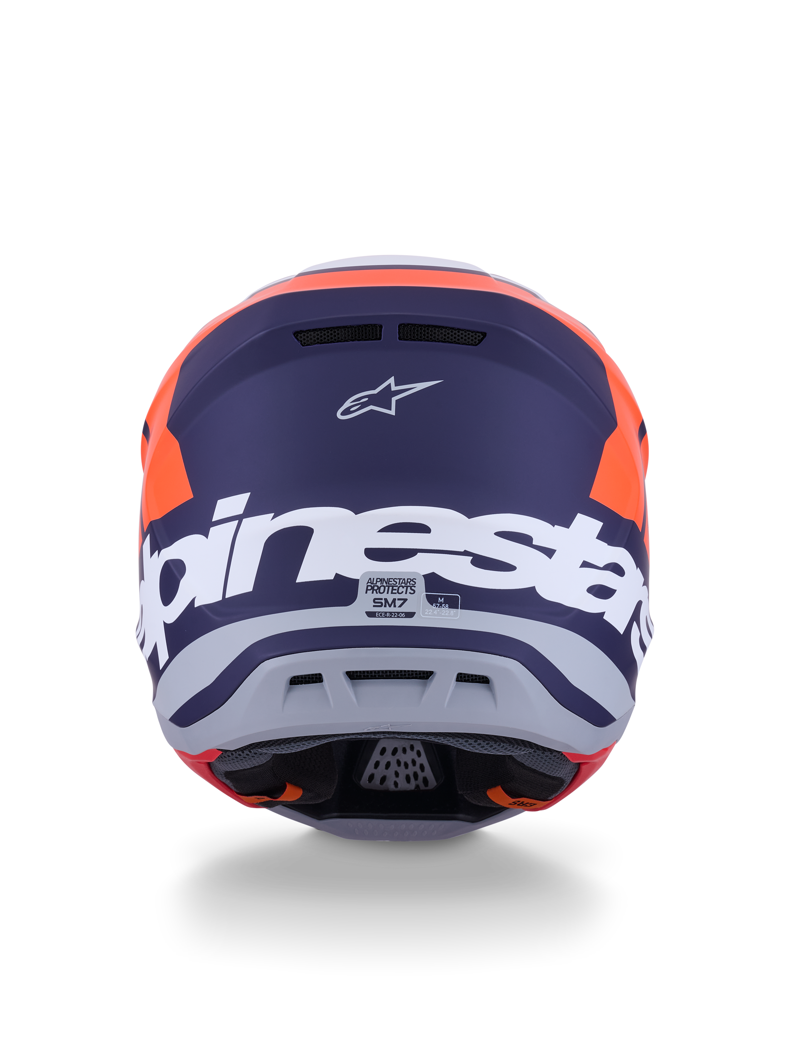 Kask Alpinestars S-M7 Core ECE 22.06, kask motocrossowy, pomarańczowy i niebieski matowy, widok z tyłu z dużym białym napisem Alpinestars i logo Astars, smukły aerodynamiczny design ze zintegrowanymi otworami wylotowymi, profesjonalna ochrona off-road