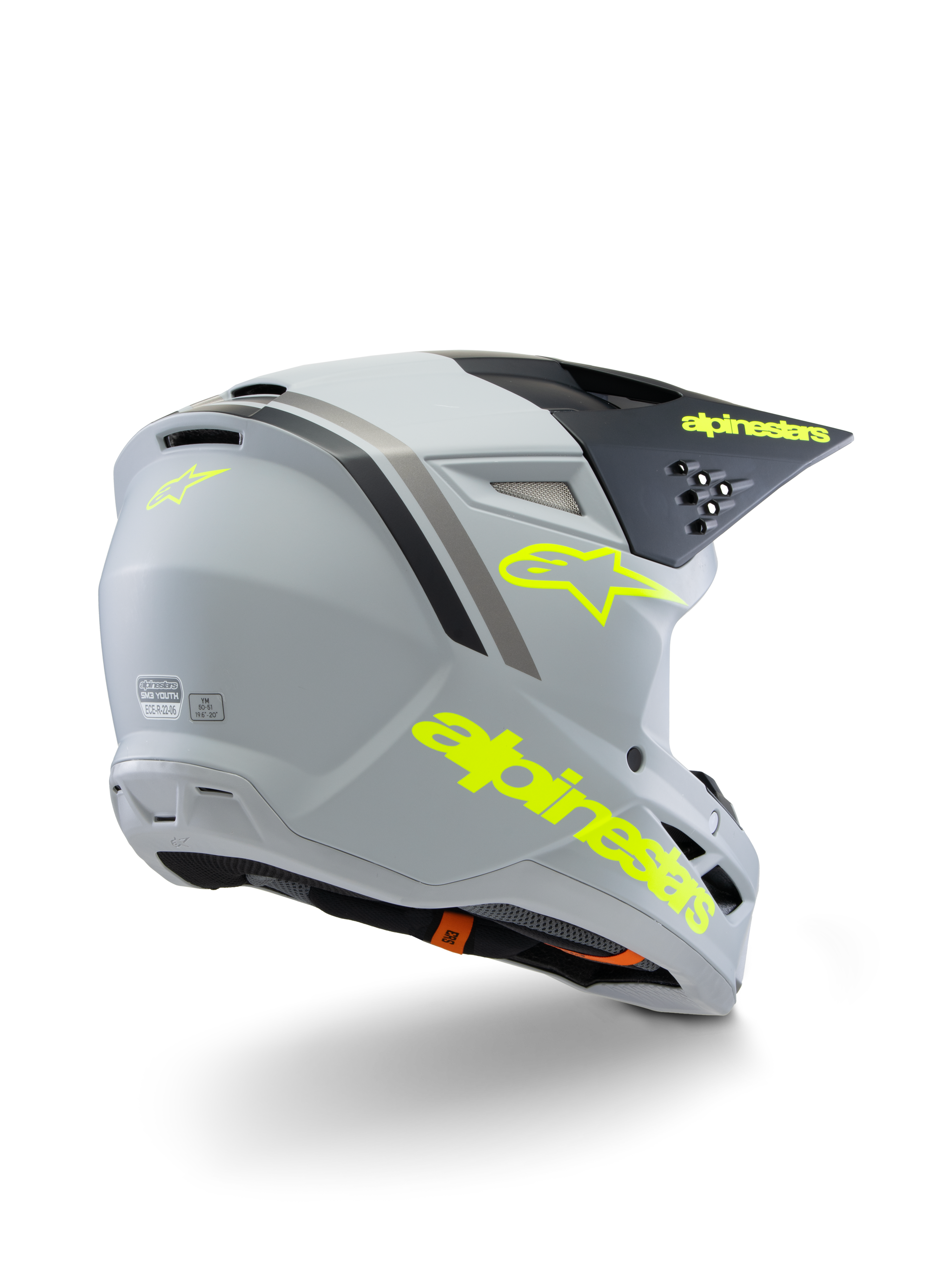 Alpinestars S-M3 Youth Radium Helmet ECE 22.06, kask motocrossowy, szaro-czarny i żółty neonowy mat, widok z tyłu pod kątem trzech czwartych pokazujący wyraźne żółte logo i znak gwiazdy, smukła aerodynamiczna skorupa z wentylacją do jazdy off-road