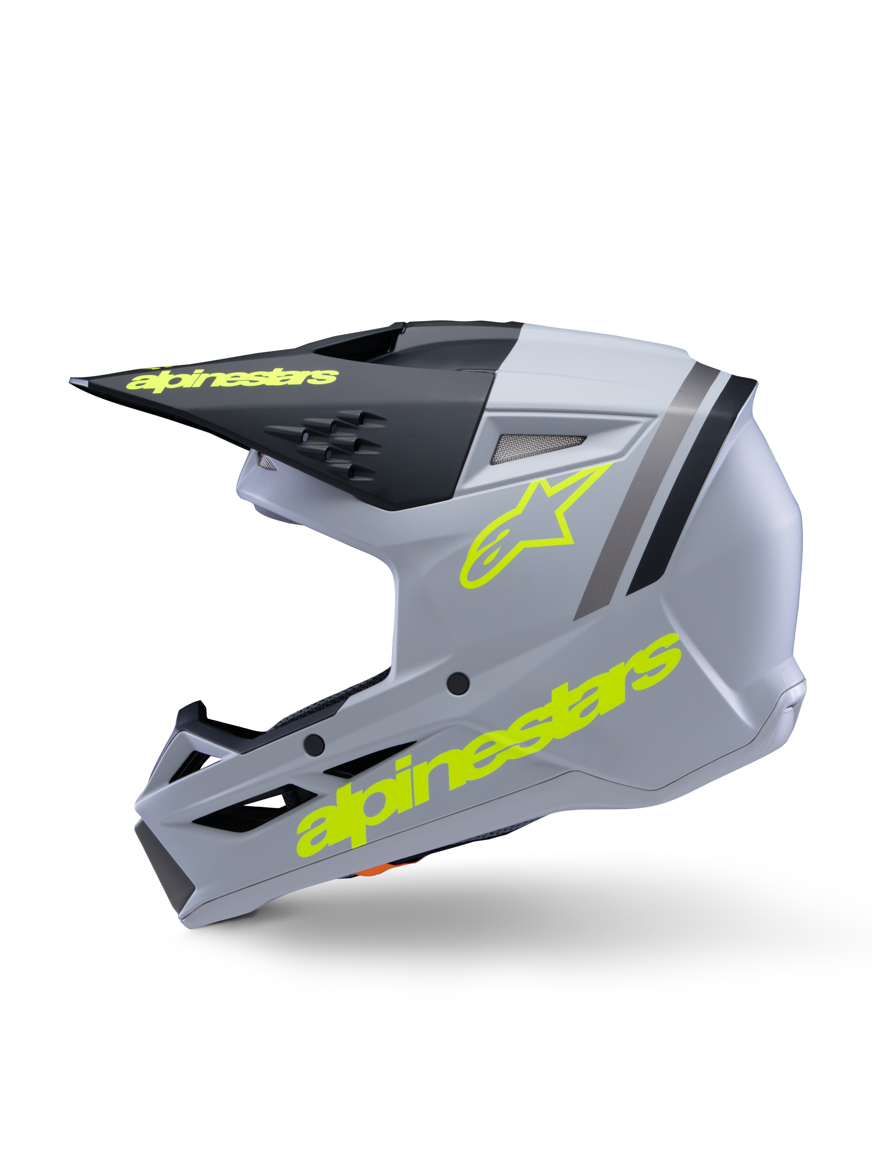 Alpinestars S-M3 Youth Radium Helmet ECE 22.06, kask motocrossowy, szary, czarny i żółty neonowy mat, widok z boku z żółtymi fluorescencyjnymi logotypami Alpinestars i czarnym daszkiem, aerodynamiczny sprzęt ochronny dla młodych zawodników