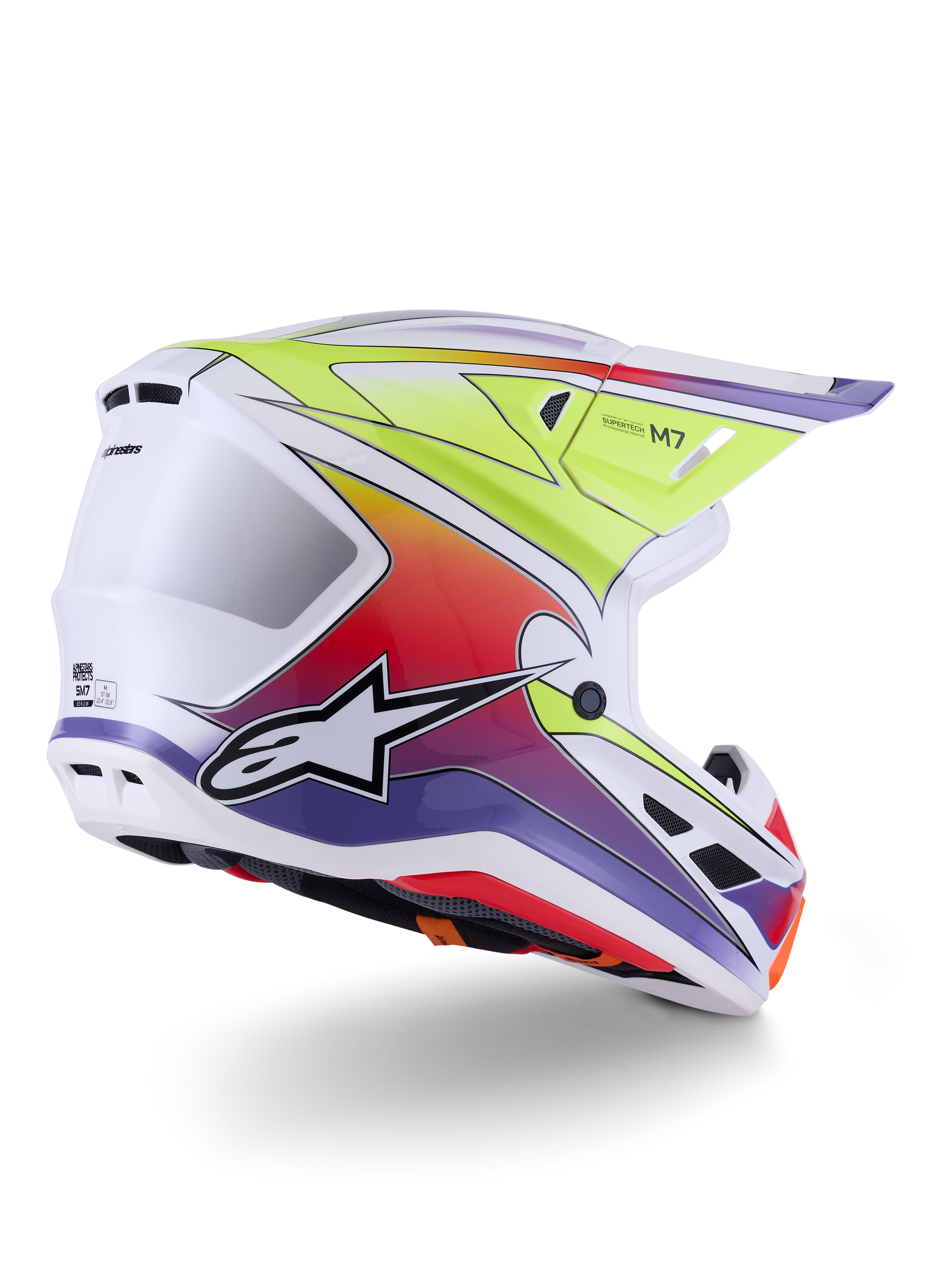 Kask Alpinestars S-M7 Fuse, kask motocrossowy, biały, żółty fluo i fioletowy połysk, żywa wielokolorowa grafika z gradientem i wyraźnym czarno-białym logo gwiazdy, aerodynamiczna skorupa kompozytowa ze zintegrowanymi otworami wentylacyjnymi, przeznaczony do wyścigów terenowych