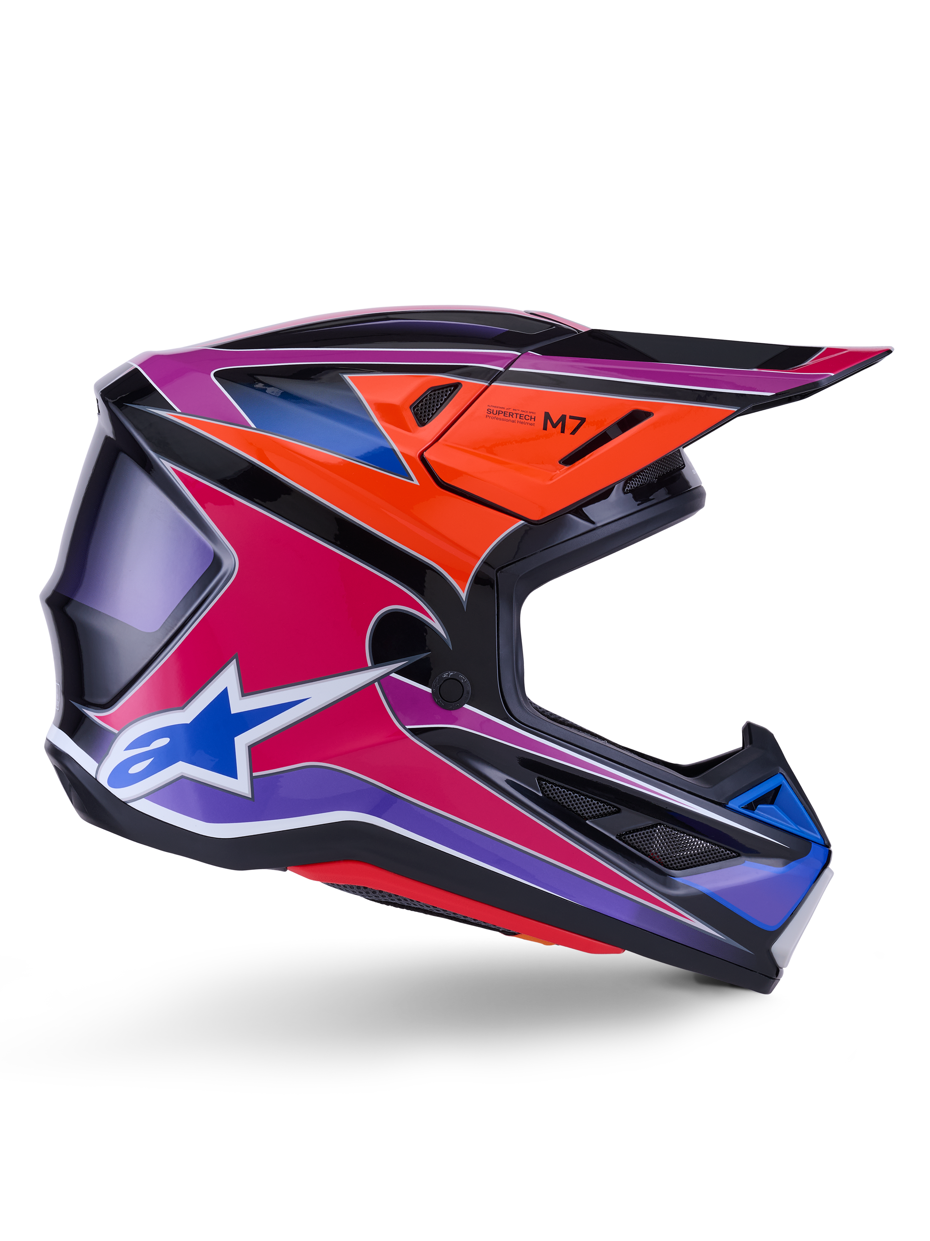 Kask Alpinestars S-M7 Fuse, kask motocrossowy, niebieski, fioletowy i różowy błyszczący, widok z profilu z żywą grafiką wyścigową, aerodynamiczna konstrukcja skorupy z otworami wentylacyjnymi i logo gwiazdy Alpinestars