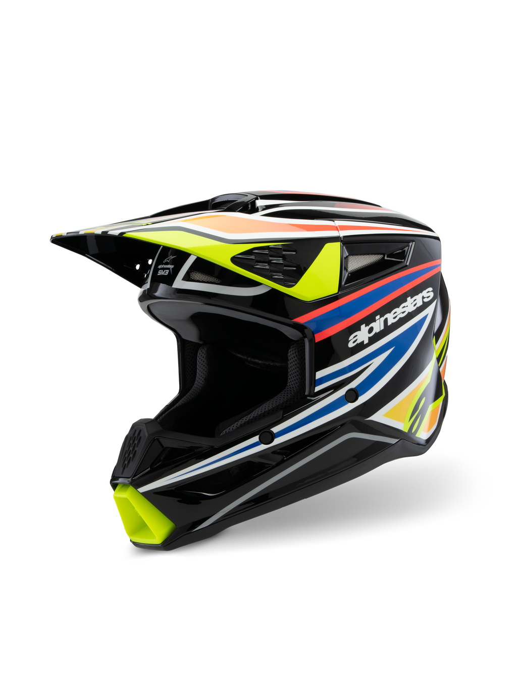 Kask Alpinestars S-M3 Youth Wurx ECE 22.06, kask motocrossowy, czarny połysk z fluorescencyjną żółcią, niebieskimi i czerwono-pomarańczowymi grafikami wyścigowymi, widok z trzech czwartych ukazujący aerodynamiczną skorupę z wlotami i wylotami powietrza, ochronny sprzęt off-road dla młodych motocyklistów
