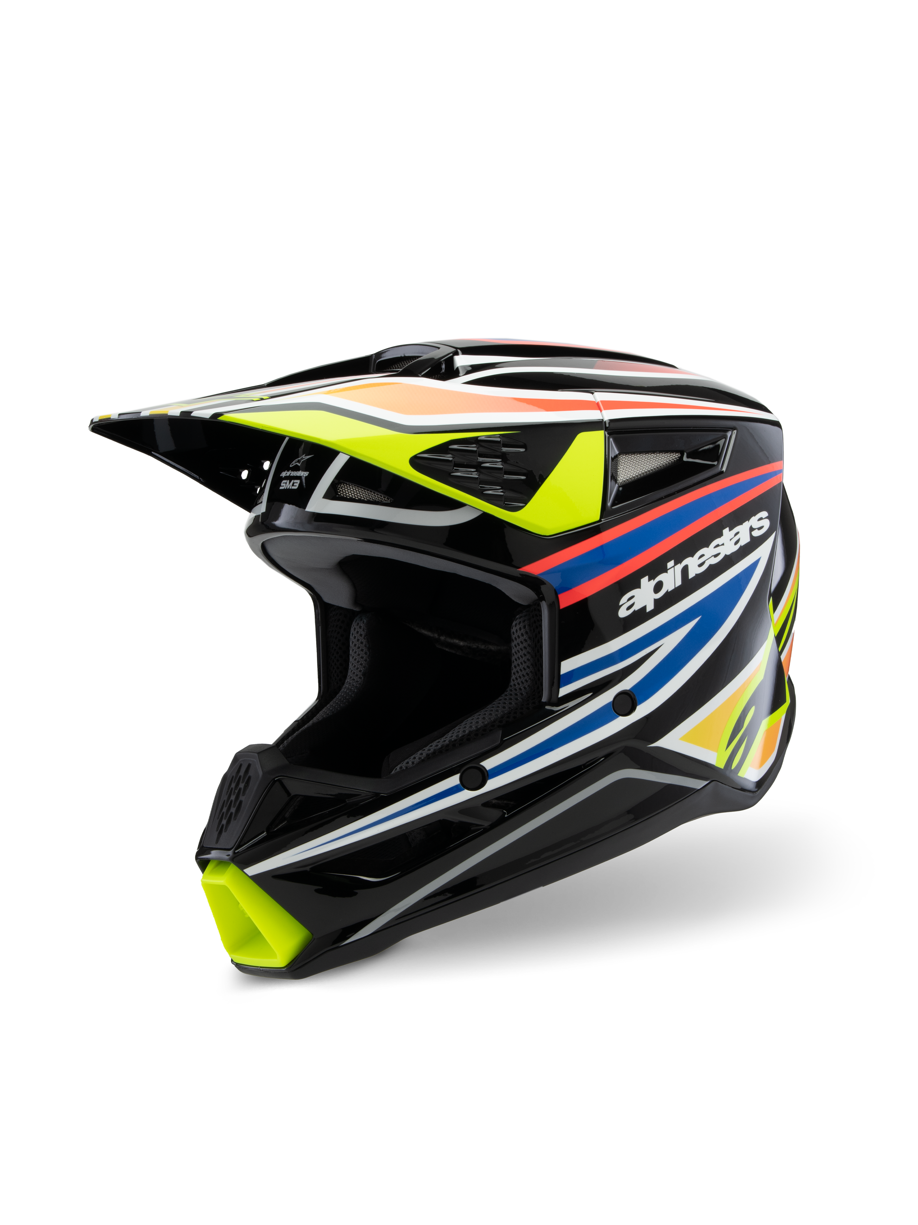 Kask Alpinestars S-M3 Youth Wurx ECE 22.06, kask motocrossowy, czarny połysk z fluorescencyjną żółcią, niebieskimi i czerwono-pomarańczowymi grafikami wyścigowymi, widok z trzech czwartych ukazujący aerodynamiczną skorupę z wlotami i wylotami powietrza, ochronny sprzęt off-road dla młodych motocyklistów