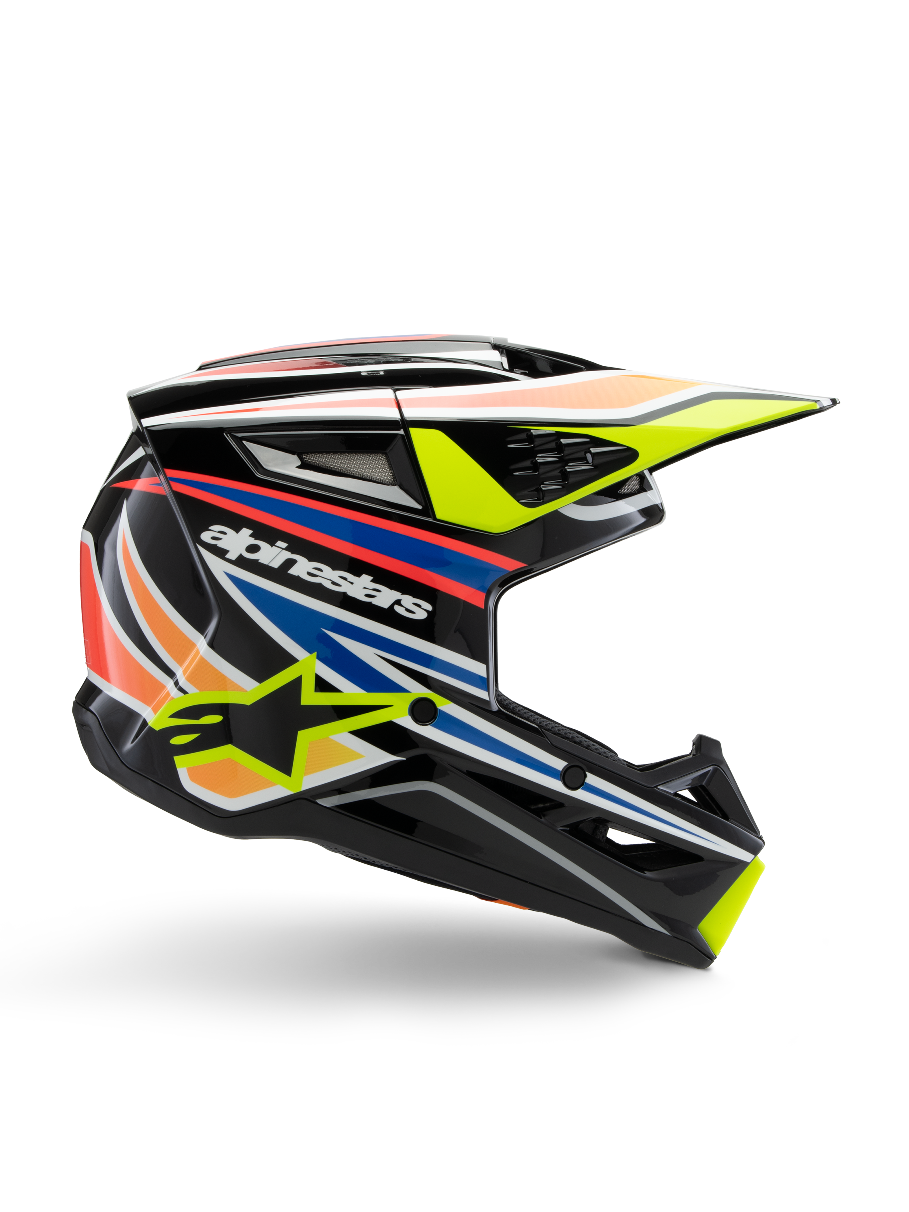Kask Alpinestars S-M3 Youth Wurx, młodzieżowy kask motocrossowy, czarny z żółtymi, niebieskimi, czerwonymi i pomarańczowymi pasami, widok z boku z aerodynamicznym daszkiem i błyszczącym wykończeniem, białe logo Alpinestars i żółta grafika gwiazdy