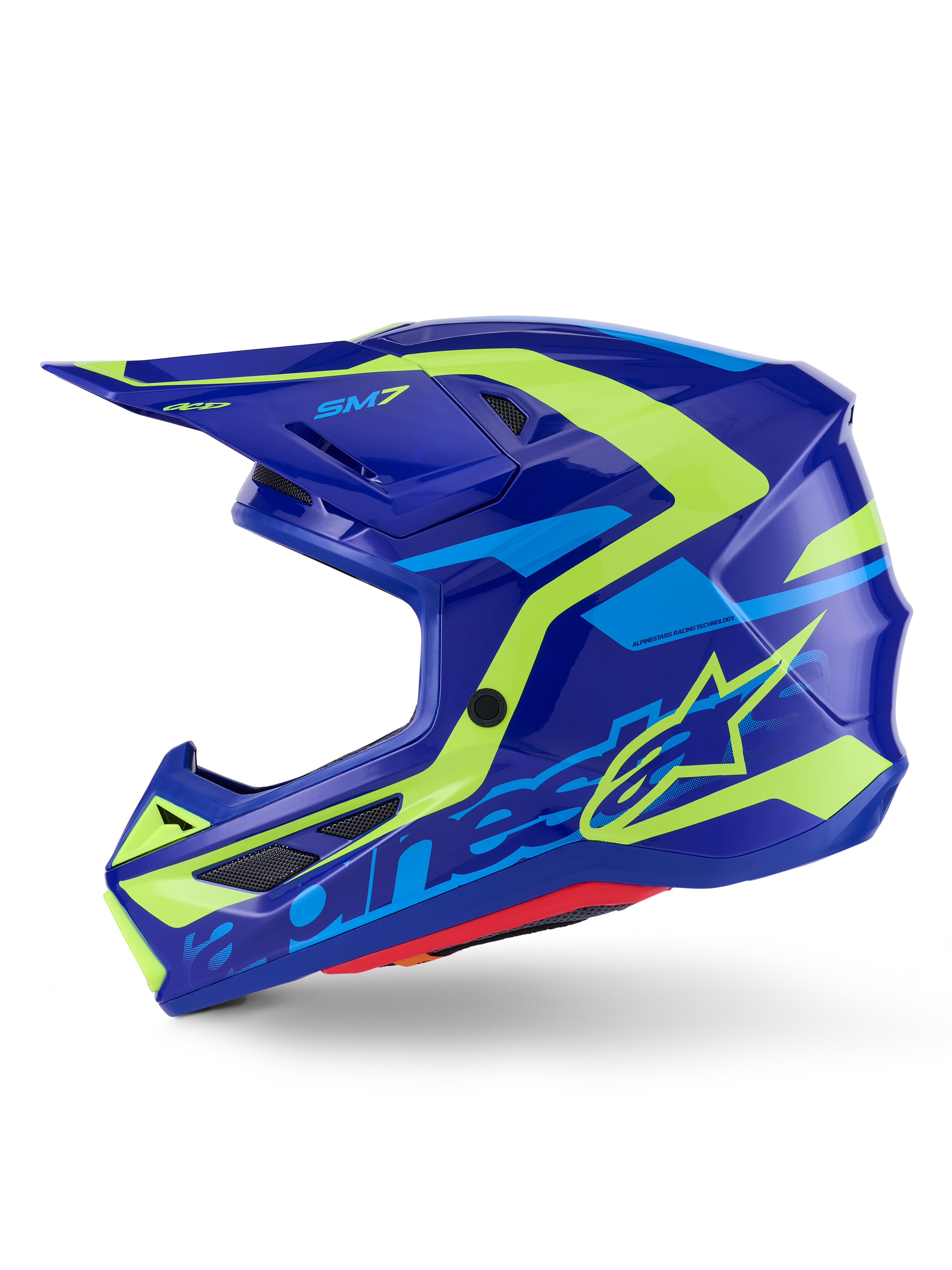 Kask Alpinestars S-M7 Deed, kask motocrossowy, niebieski i żółty neonowy połysk, widok z boku, smukła aerodynamiczna kompozytowa skorupa z jaskrawymi żółtymi i jasnoniebieskimi grafikami, otwory wentylacyjne osłonięte siatką i daszek zapewniający wydajność w terenie