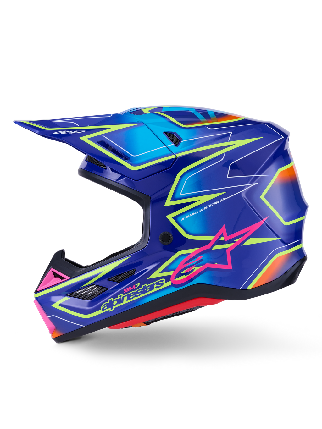 Alpinestars S-M7 Cast Helmet, kask motocrossowy, niebieski z różowymi i żółtymi błyszczącymi akcentami fluo, widok z boku prezentujący aerodynamiczną skorupę kompozytową, zintegrowane otwory wentylacyjne, różowe logo z gwiazdą i żółte oznaczenia marki, zaprojektowany z myślą o ochronie w wyścigach terenowych.