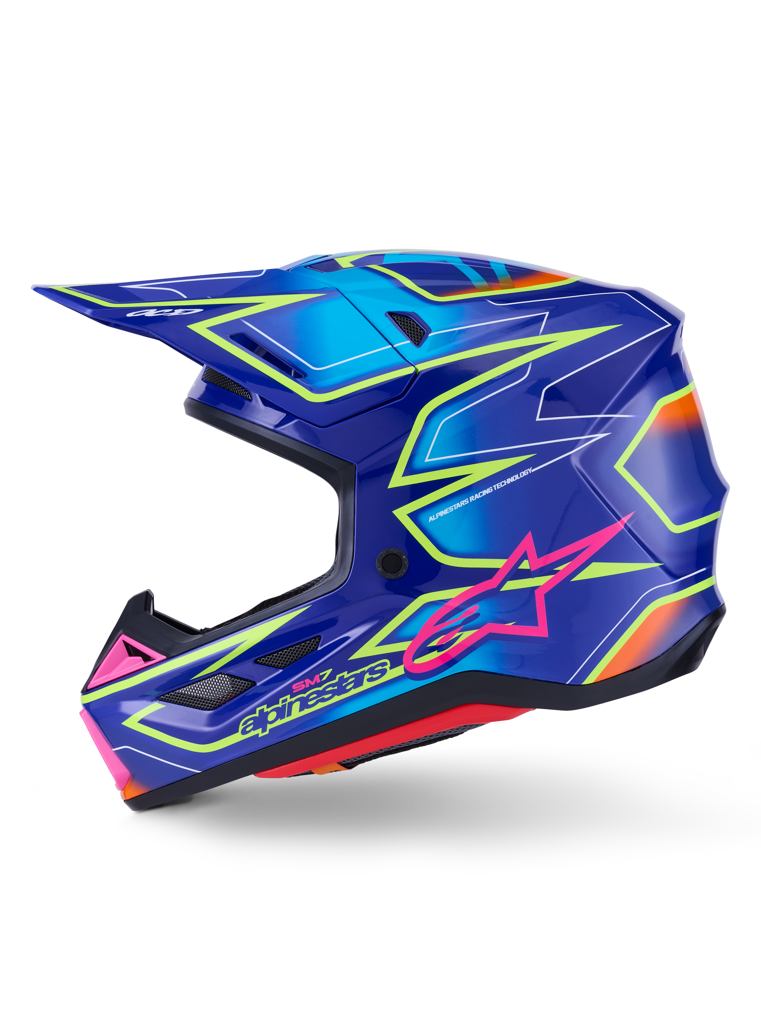Alpinestars S-M7 Cast Helmet, kask motocrossowy, niebieski z różowymi i żółtymi błyszczącymi akcentami fluo, widok z boku prezentujący aerodynamiczną skorupę kompozytową, zintegrowane otwory wentylacyjne, różowe logo z gwiazdą i żółte oznaczenia marki, zaprojektowany z myślą o ochronie w wyścigach terenowych.