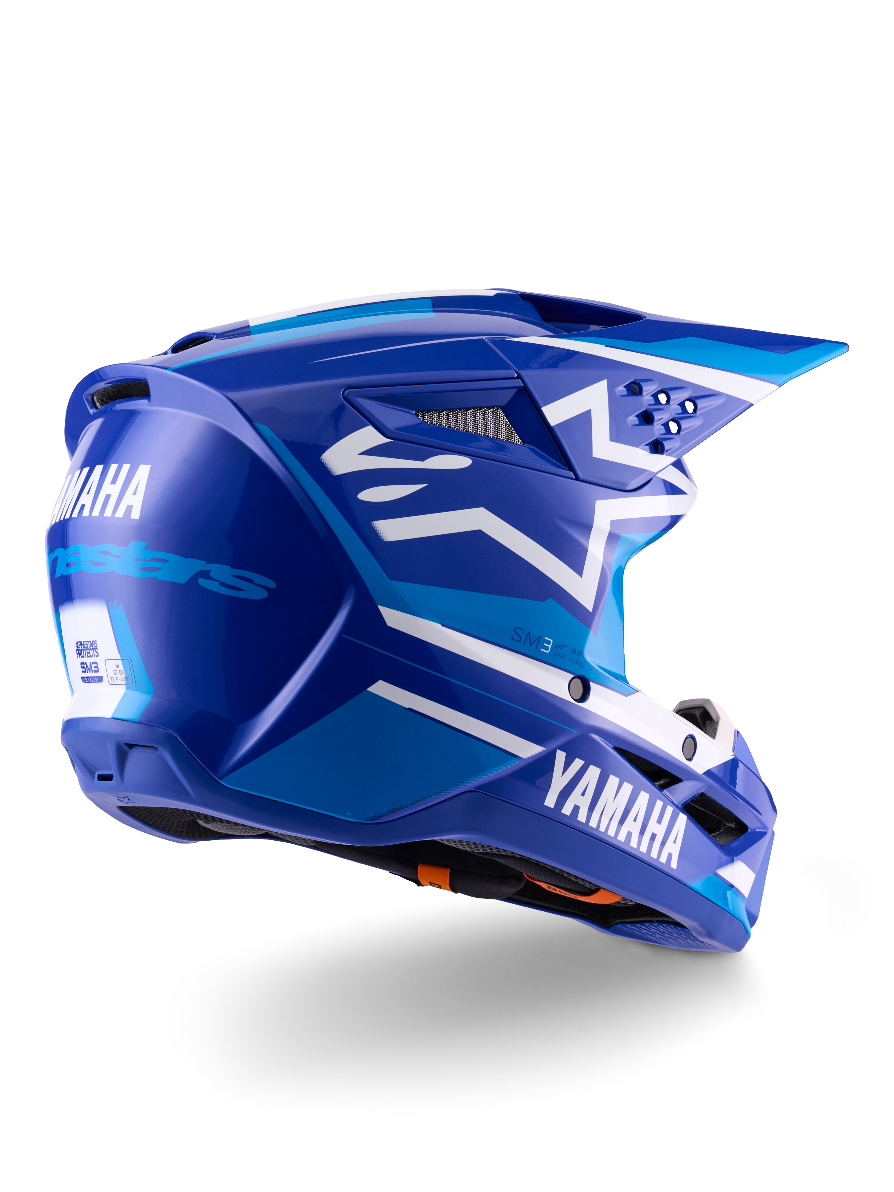 Kask Alpinestars Yamaha S-M3 ECE 22.06, kask motocrossowy, niebiesko-biały z połyskiem, z brandingiem Yamaha i Alpinestars, białe logo gwiazdy z boku, liczne otwory wlotowe i wylotowe, aerodynamiczna konstrukcja do jazdy w terenie
