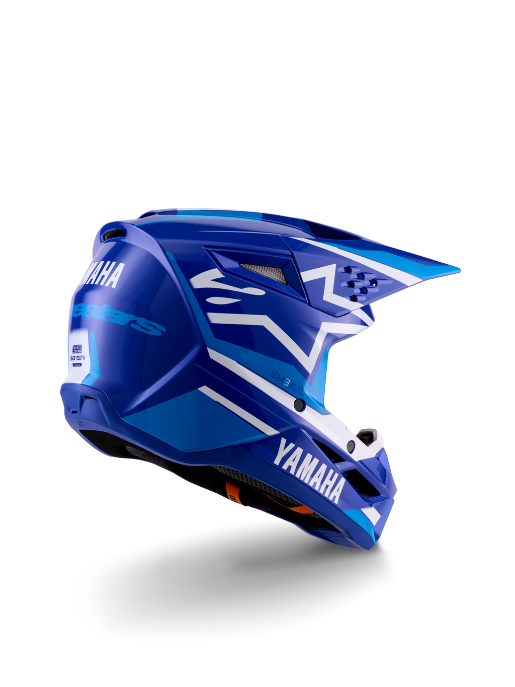 Kask motocrossowy Alpinestars Yamaha S-M3 Youth, niebiesko-biały błyszczący, z wyraźnym brandingiem Yamaha z boku i z tyłu, aerodynamiczna konstrukcja skorupy z tylną wentylacją, ochrona głowy off-road dla młodzieży, widok z tyłu pod kątem 3/4.