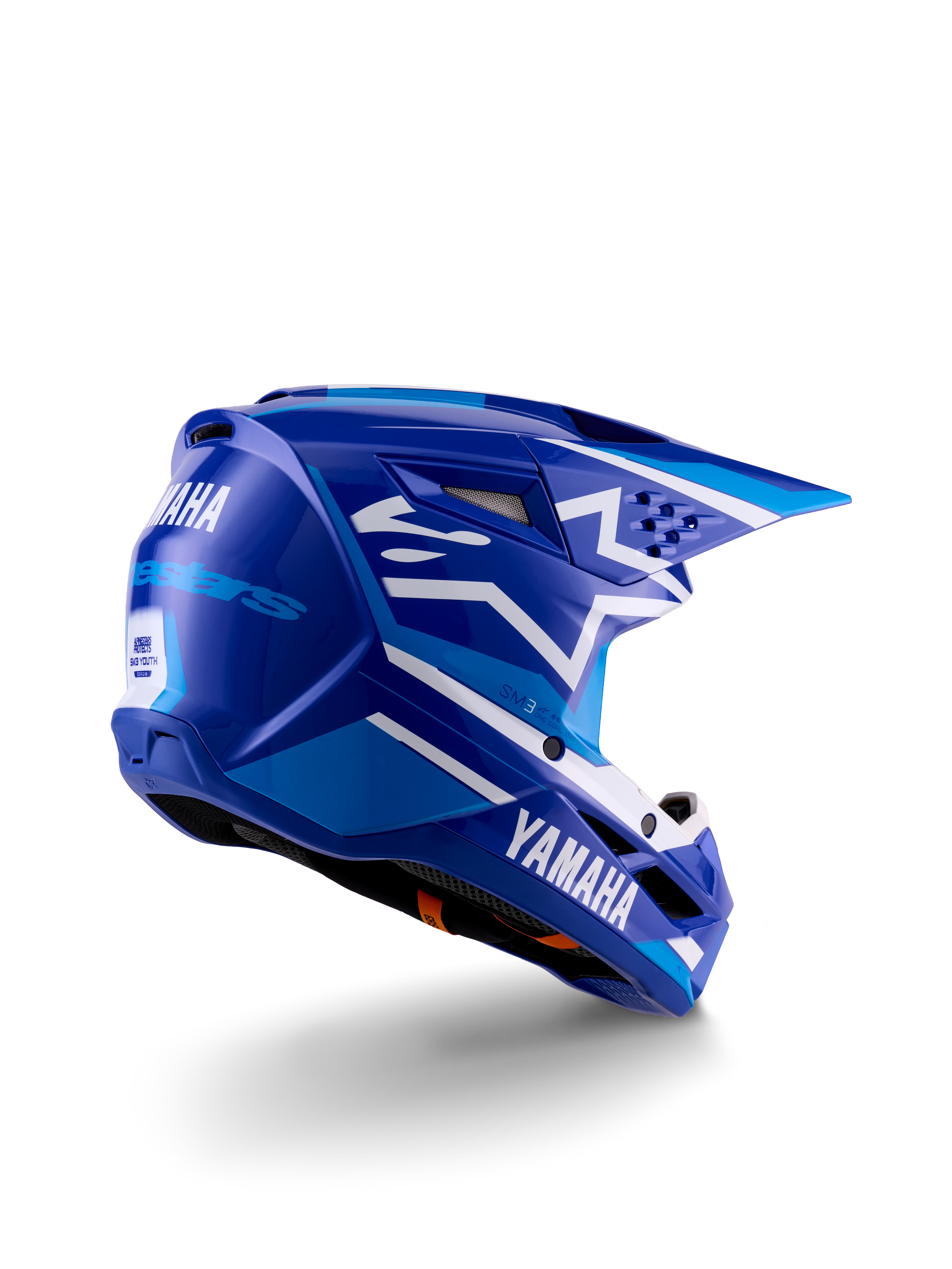 Kask motocrossowy Alpinestars Yamaha S-M3 Youth, niebiesko-biały błyszczący, z wyraźnym brandingiem Yamaha z boku i z tyłu, aerodynamiczna konstrukcja skorupy z tylną wentylacją, ochrona głowy off-road dla młodzieży, widok z tyłu pod kątem 3/4.