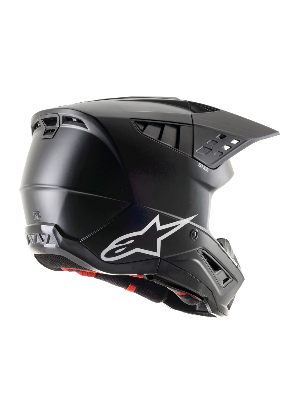 Alpinestars S-M5 Solid Helmet ECE 22.06, czarny matowy kask motocrossowy, widok z profilu boczno-tylnego z białym logo Alpinestars, licznymi otworami wentylacyjnymi i zintegrowanym daszkiem dla ochrony w terenie