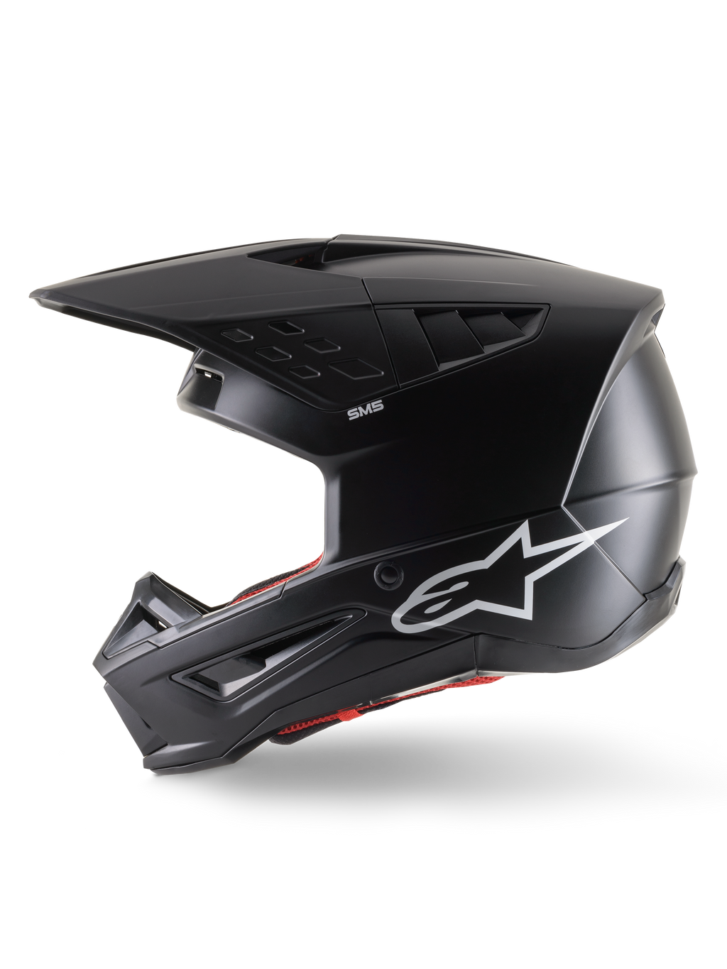 Alpinestars S-M5 Solid Helmet ECE 22.06, kask motocrossowy, czarny mat, widok z profilu, eleganckie matowe wykończenie, białe logo Alpinestars z boku, czerwona wyściółka wewnętrzna, aerodynamiczna skorupa ze zintegrowanymi otworami wentylacyjnymi