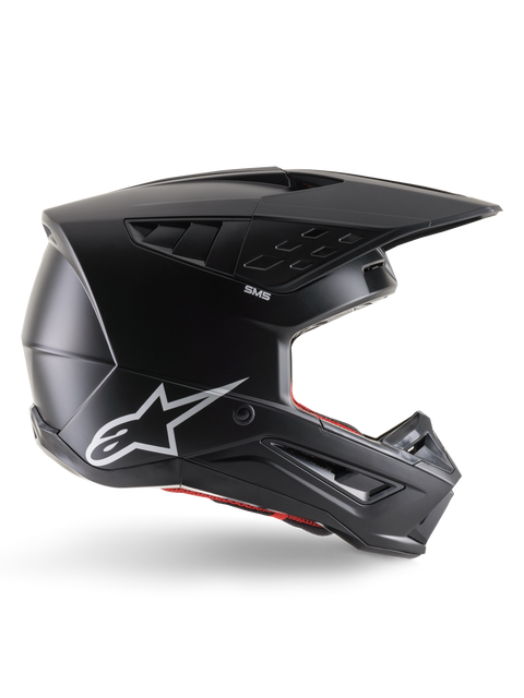 Alpinestars S-M5 Solid Helmet, kask motocrossowy, czarny matowy z białym logo Alpinestars i czerwoną wyściółką, aerodynamiczny design z wieloma otworami wentylacyjnymi i długim daszkiem, certyfikowana ochrona off-road ECE 22.06