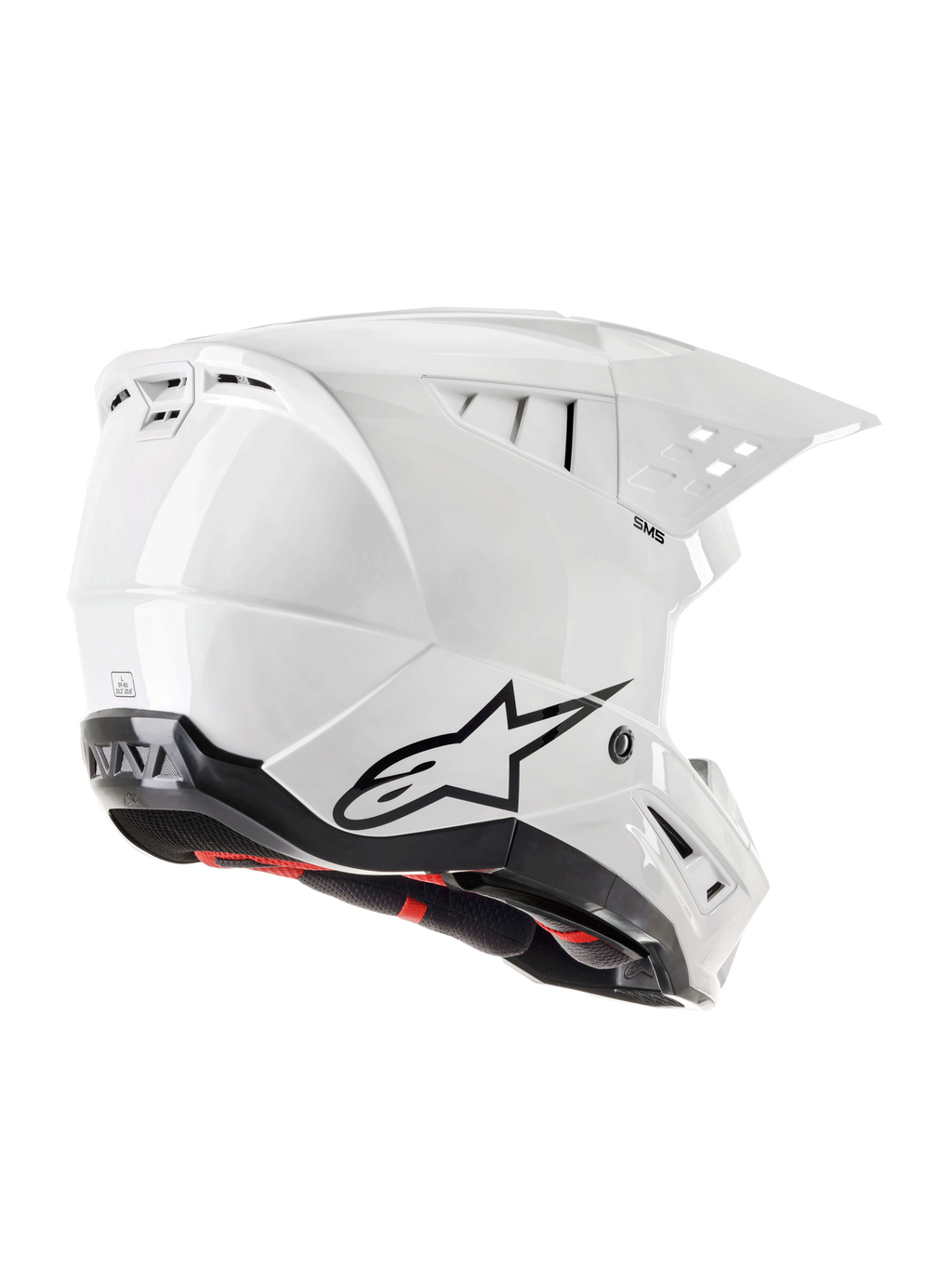 Kask Alpinestars S-M5 Solid ECE 22.06, kask motocrossowy, biały błyszczący, widok z tyłu z boku z czarnym logo Astars, zintegrowane otwory wentylacyjne i smukła aerodynamiczna konstrukcja skorupy
