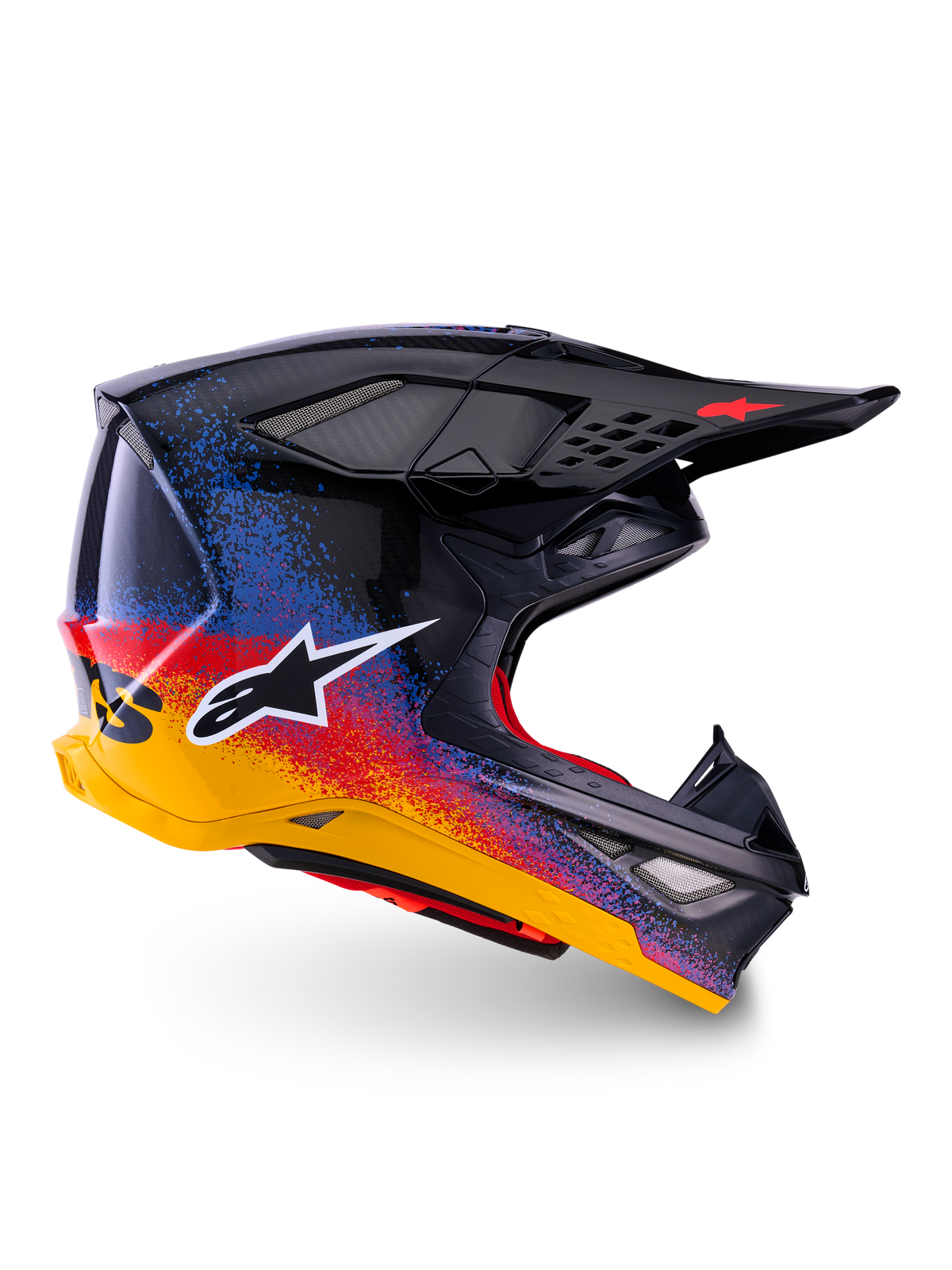 Alpinestars Limited Edition Supertech M10 Black Hole Helmet, Motocross Racing Helmet, Black shell with red, blue, and yellow gradient splatter design, white star logo on side, aerodynamic profile with mesh-covered ventilation ports, red interior padding, and long black visor.