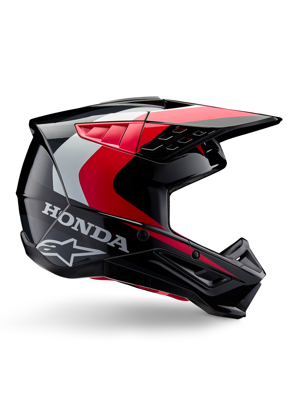 Honda S-M5 Helmet, Motocross Helmet, Black Red Glossy with white and silver accents, side view featuring Honda and Alpinestars logos, aerodynamic design with visor and multiple ventilation ports, professional off-road protective gear