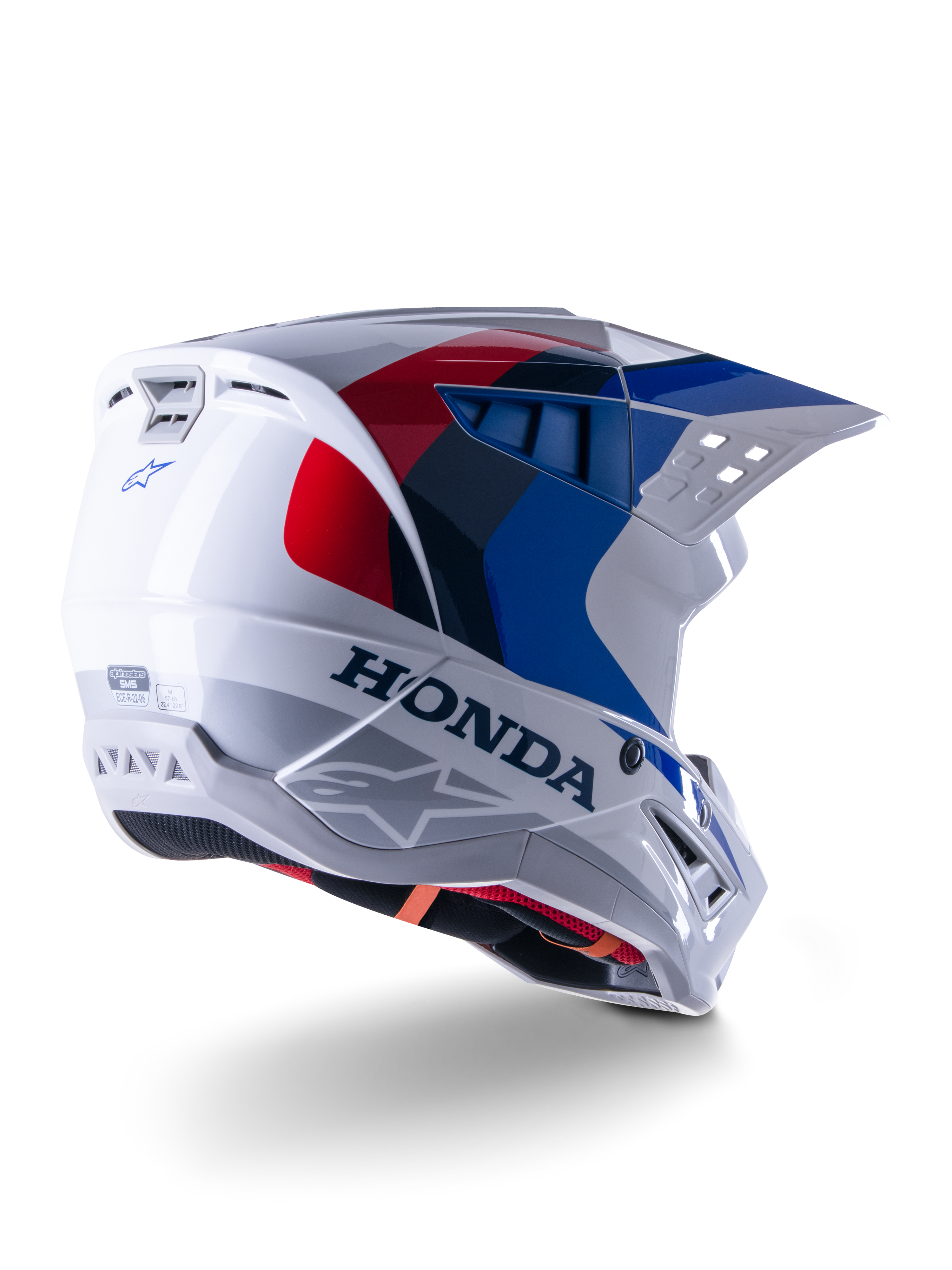 Alpinestars Honda S-M5 Helmet ECE, kask motocrossowy, biało-niebiesko-czerwony z połyskiem, z wyraźnym brandingiem Honda i logo Alpinestars, aerodynamiczna skorupa ze zintegrowanymi otworami wentylacyjnymi i regulowanym daszkiem, sprzęt ochronny do wyścigów off-road