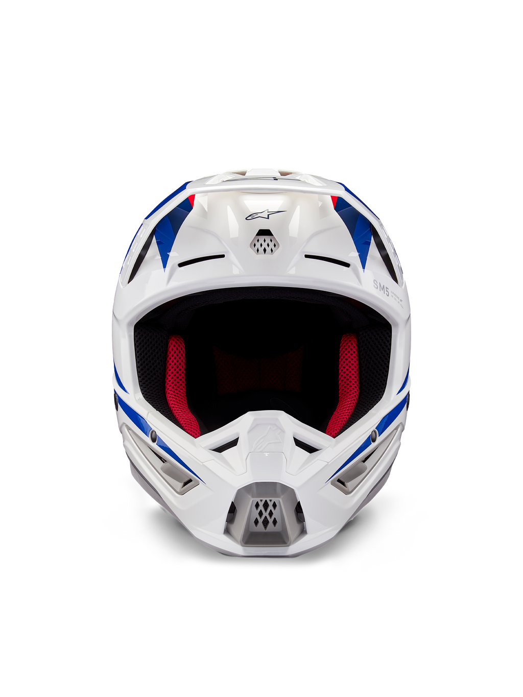 Kask Alpinestars Honda S-M5 ECE, kask motocrossowy, biało-niebiesko-czerwony z połyskiem, widok z przodu ukazujący otwory wentylacyjne i czerwoną wyściółkę wewnętrzną, aerodynamiczna konstrukcja zapewniająca ochronę w wyścigach terenowych