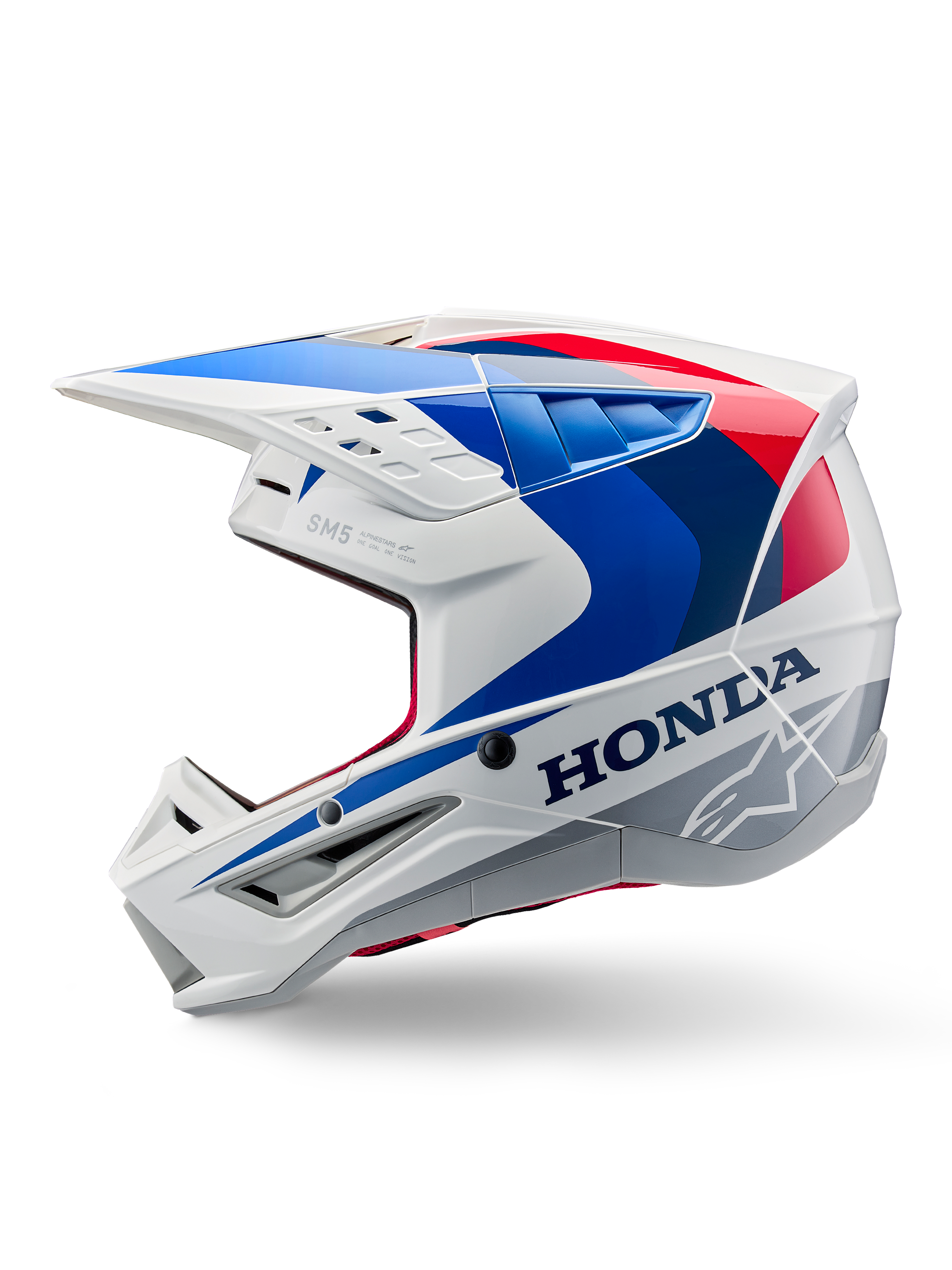 Kask Alpinestars Honda S-M5 ECE, biało-niebiesko-czerwony połysk, widok z boku, z wyraźnym brandingiem Honda i logo gwiazdy Alpinestars, aerodynamiczny design motocrossowy z licznymi otworami wentylacyjnymi i wyraźnym daszkiem, błyszczące wykończenie